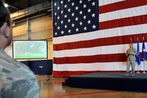 OFFUTT AIR FORCE BASE, Neb. - Team Offutt members listen to 55th Wing Commander Brigadier Gen. John N.T. Shanahan during a commander's call Sept 9. inside the Bennie Davis Maintenance Facility. General Shanahan addressed topics such as team work, drinking responsibly and the unit compliance inspection in the coming weeks. U.S. Air Force photo by Charles Haymond