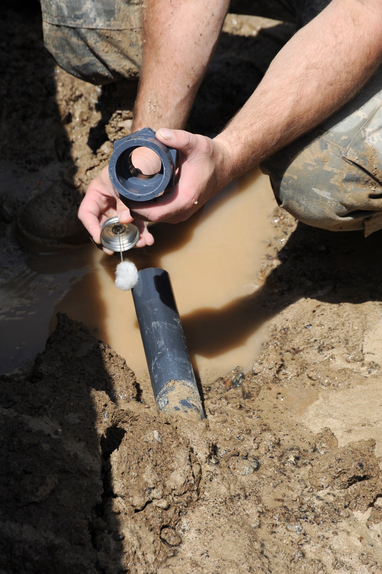 Staff Sgt. Brian Schultz, 380th Civil Engineer Squadron assistant NCO in charge water fuels system maintenance, prepares to fix a broken water pipe Sept. 14, 2010, at an undisclosed location in Southwest Asia. (U.S. Air Force photo/Tech. Sgt. April Wickes) 