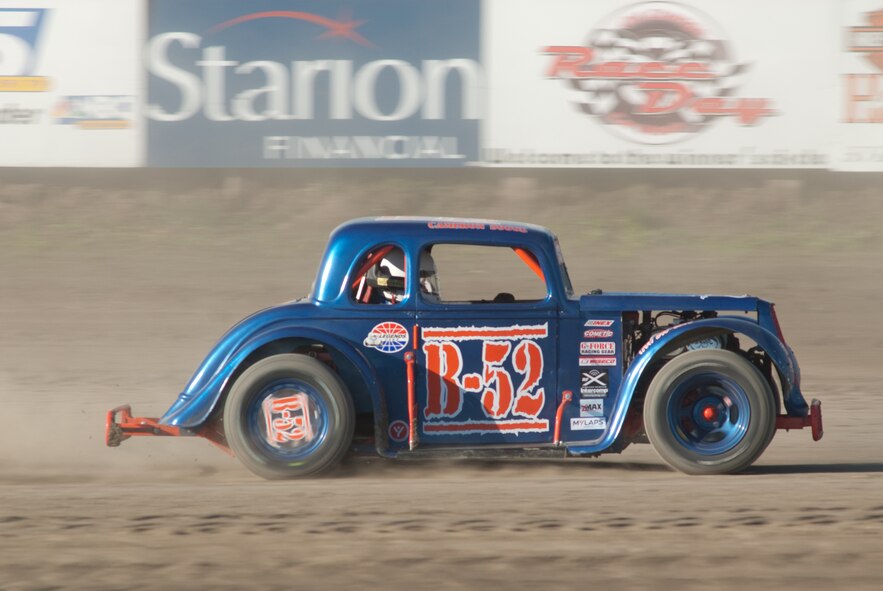 MANDAN, N.D. -- Tech. Sgt. Cameron D. Sogge, 5th Maintenance Group Weapons Standardization Team squadron lead load crew chief at Minot Air Force Base, races to the front during a heat race at the Dacotah Speedway here during the summer of 2010. Sergeant Sogge is not only a load crew chief, but is a member of the NODAK Race Club and a circle track dirt racing enthusiast, racing anywhere from 15 to 25 races a year. (Courtesy photo) 