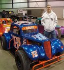 MINOT, N.D. -- Tech. Sgt. Cameron D. Sogge, 5th Maintenance Group Weapons Standardization Team squadron lead load crew chief at Minot Air Force Base, stands with his car which proudly bears the number ‘B-52’ during the Wild About Wheels car show at the State Fair Center here in March 2010. Sergeant Sogge is not only a load crew chief, but is a member of the NODAK Race Club and a circle track dirt racing enthusiast, racing anywhere from 15 to 25 races a year. (Courtesy photo)  