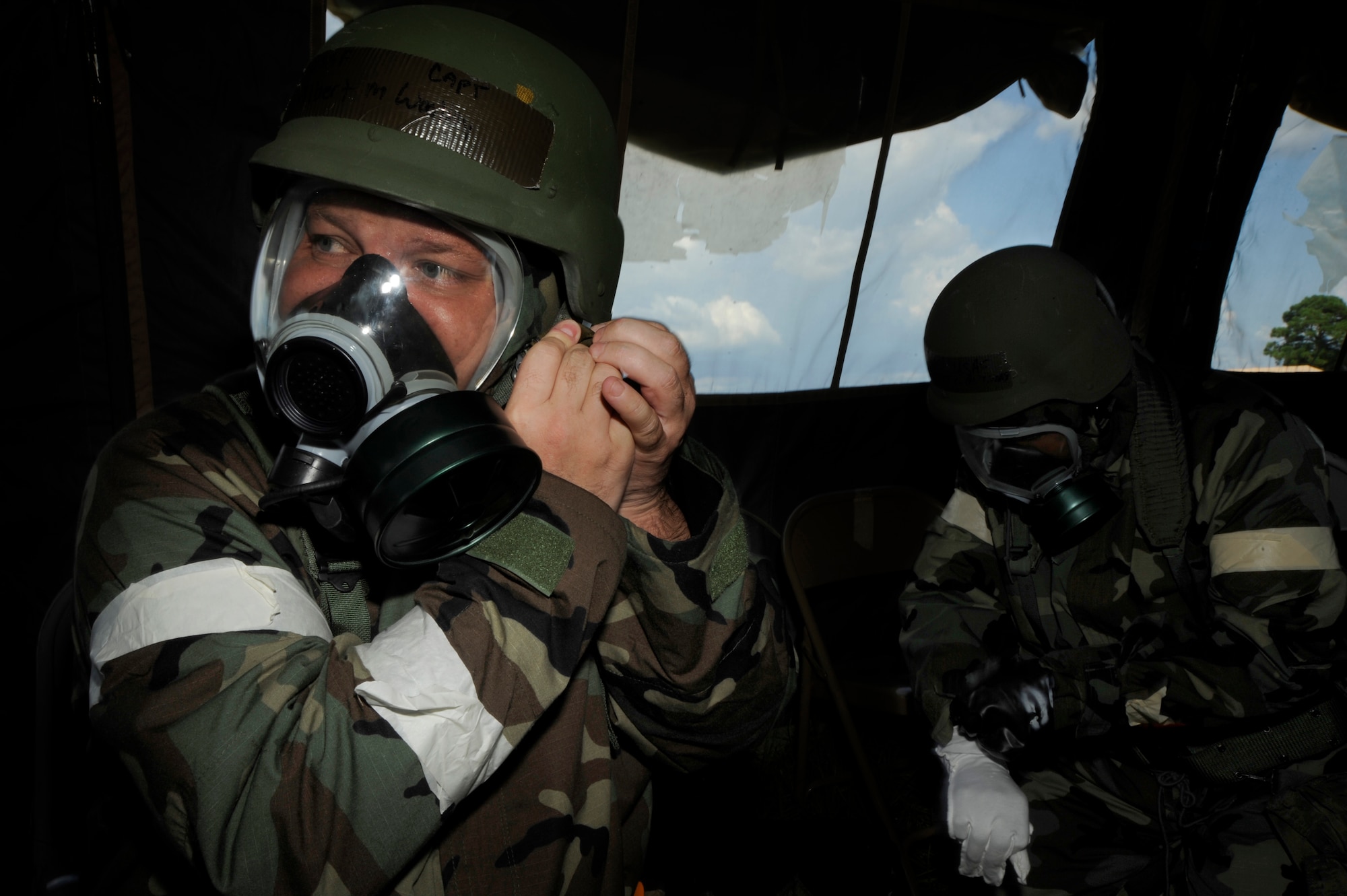 Capt. Albert Woolley, 927th Air Refueling Wing, dons his gas mask during a training exercise at Camp Thunder, MacDill Air Force Base, Fla., Sept. 12, 2010. More than 300 Airmen from the 6th Air Mobility Wing and the 927th ARW participated in the training in preparation for the upcoming Operational Readiness Exercise.  (U.S. Air Force photo by: Staff Sgt. Angela Ruiz)