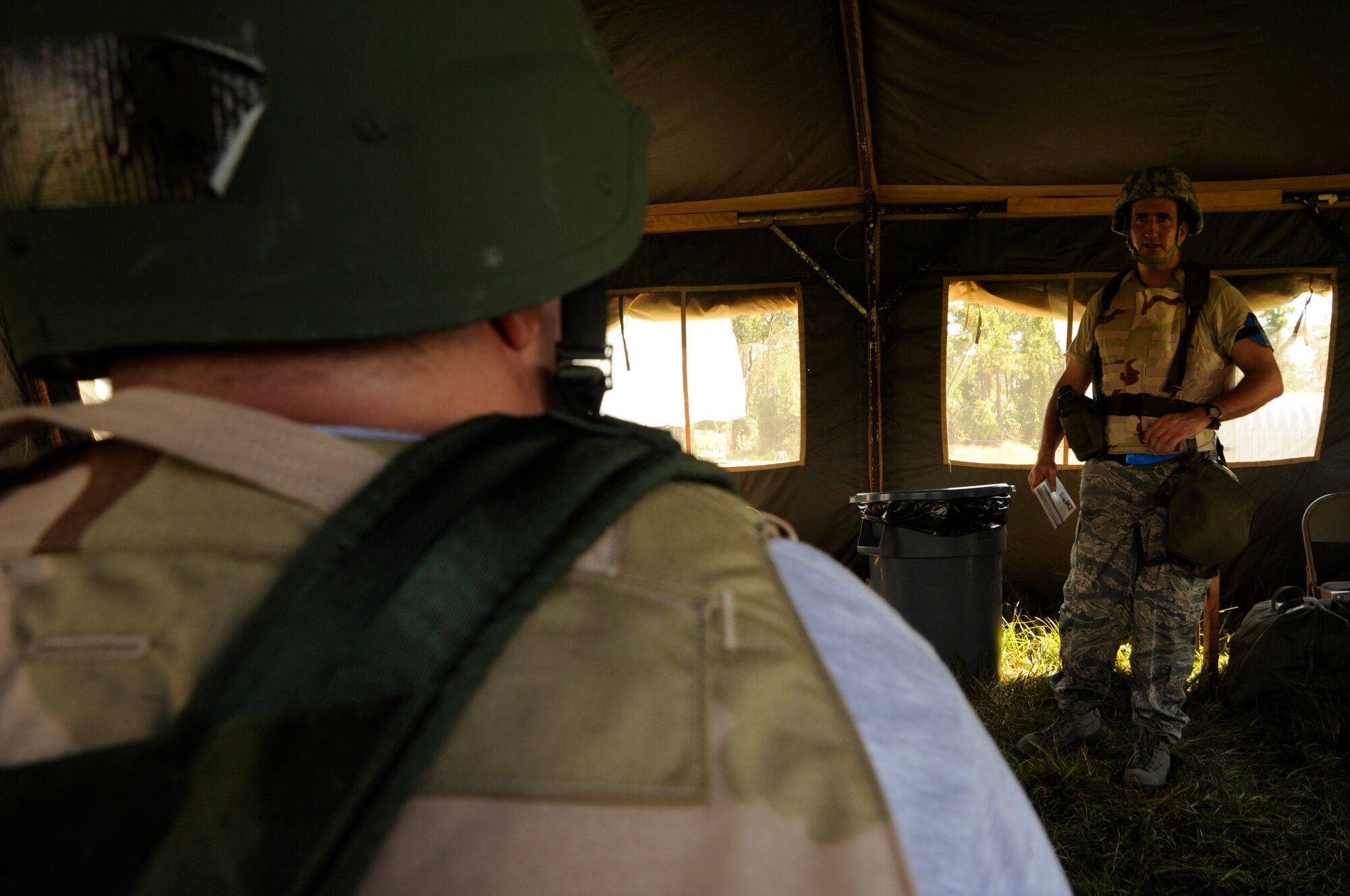 Airmen receive instructions by Maj. Gibb Gary, 6th Air Mobility Wing flight safety chief, during a training exercise at Camp Thunder, MacDill Air Force Base, Fla., Sept. 11, 2010. More than 300 Airmen from the 6th AMW and the 927th Air Refueling Wing participated in the training in preparation for the upcoming Operational Readiness Exercise. (U.S. Air Force photo by: Staff Sgt. Angela Ruiz)