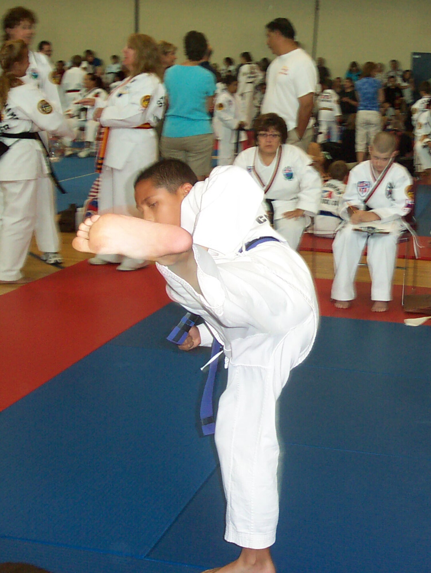 Peterson TaeKwonDo Club member Tobias McMillan performs a reverse hook kick in the forms category, boy’s ages 11-13 purple and blue belts, at the Fall Regional TaeKwonDo Tournament in Littleton, Colo., Aug. 21. Tobias placed second in sparring. There were six Peterson competitors and all placed in their individual categories. (Courtesy photo)