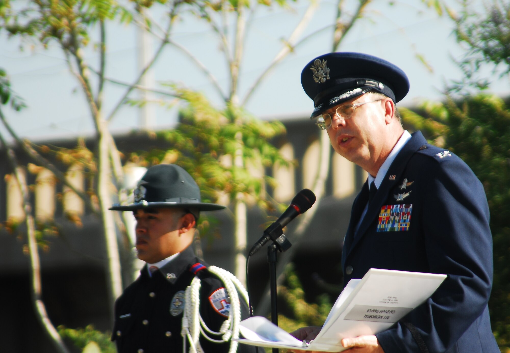Col. David Rearick, 17th Training Wing Vice Commander, speaks to the San Angelo community during a 9/11 Memorial Service about that day and the community's relationship with the wing at the 9/11 Memorial Monument near the San Angelo Museum of Fine Arts Sept. 11. The event also honored a resident, Judy Rowlett, who died during the Sept. 11, 2001, attack at the Pentagon. (U.S. Air Force photo/Kent Cummins)