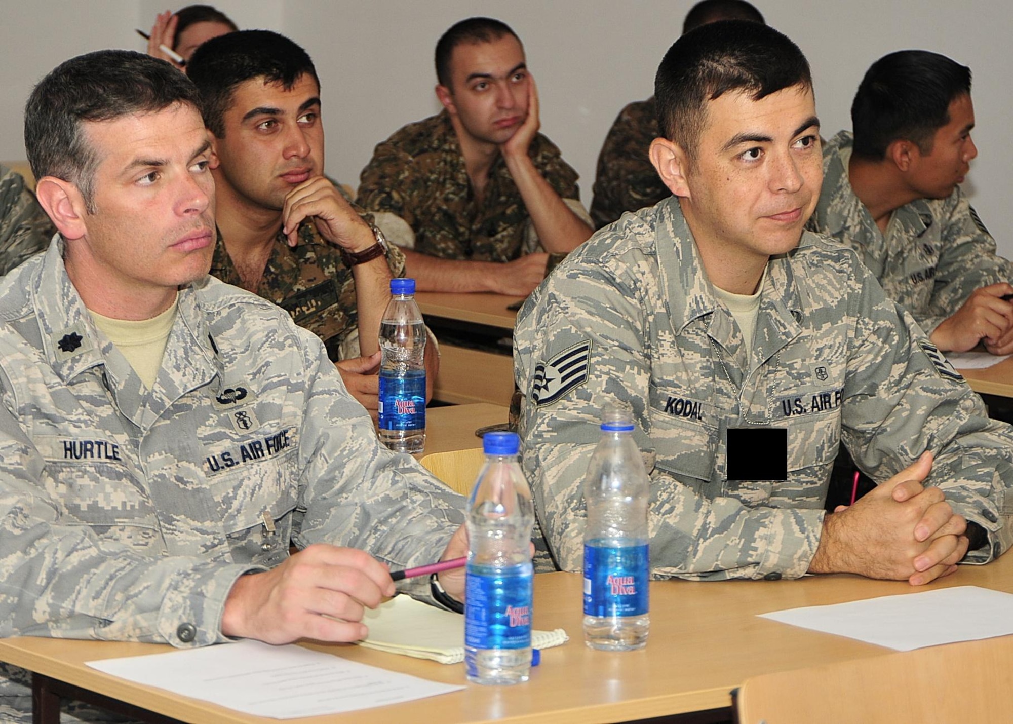 (left to right) Lt. Col. William Hurtle, flight commander of bioenvironmental engineering for the 48th Aerospace Medical Squadron, and Staff Sgt. Kerim Kodal, a radiology technologist for the 48th Medical Surgical Squadron, both from RAF Lakenheath, England, attend a class on chemical, biological, radiological, nuclear and explosive weapons during MEDCEUR10, a medical training exercise in central and eastern Europe, at Danilovgrad Army Base, Montenegro Sept. 14. Servicemembers from Armenia, Azerbaijan, Georgia, Macedonia, Montenegro, Ukraine and the United States attended the class. For more information go to www.usafe.af.mil/medceur.asp and www.odbrana.gov.me. (U.S. Air Force photo/Airman 1st Class Tiffany Deuel)