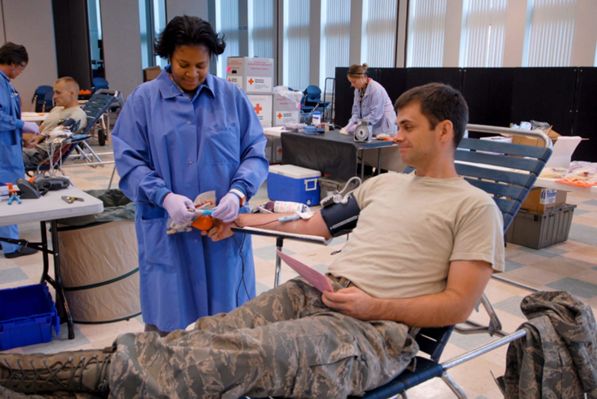 Staff Sgt. Nathan Goff, 180th Fighter Wing, donates blood at a Red Cross blood drive hosted at the 180th Fighter Wing, September 8. The 180th FW has been hosting blood drives for unit members since 2004. Throughout that time, 180th members have donated 438 units of blood. (U.S. Air Force Photo by Master Sgt. Beth Holliker/Released).