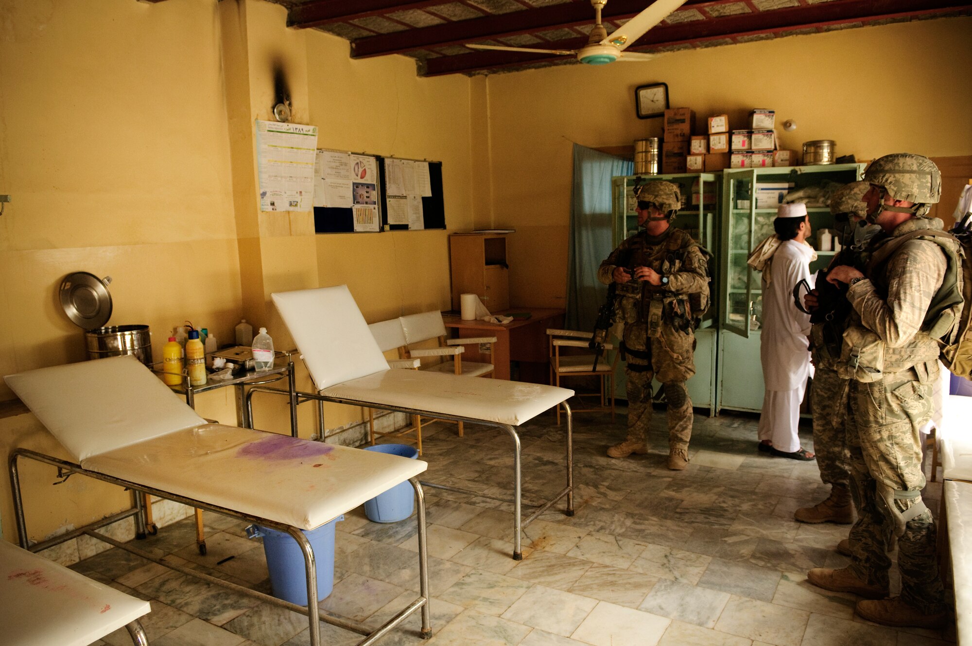 FORWARD OPERATING BASE BULLARD, Afghanistan - Medics assigned to the Provincial Reconstruction Team Zabul Shah Joy District Support Team inspect the emergency room at a local hospital, Shah Joy District, Zabul province, Sept. 11, 2010. The PRT inspected the hospital to assess the repair needed for an upcoming renovation. (U.S. Air Force Photo/Senior Airman Nathanael Callon/Released)