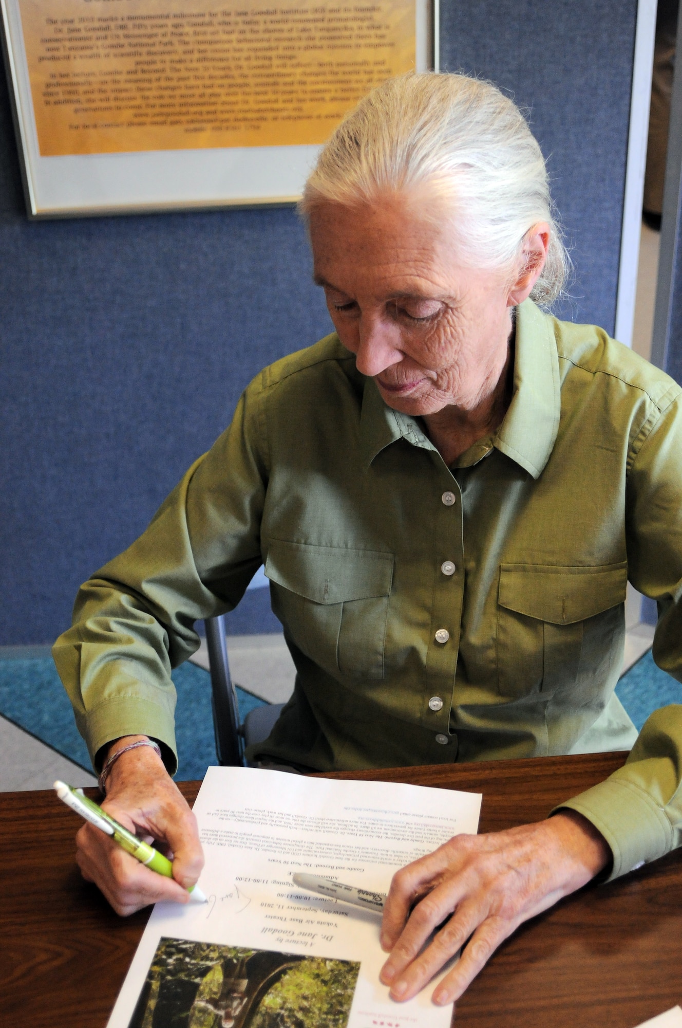 YOKOTA AIR BASE, Japan -- Dr. Jane Goodall spent an hour after her lecture signing autographs for residents of Yokota Air Base at the base theatre, September 11. Dr. Goodall visited Yokota in order to spread the word about the Roots and Shoots program and the human impact on the environment. (U.S. Air Force Photo/ Airman 1st Class Katrina R. Menchaca)