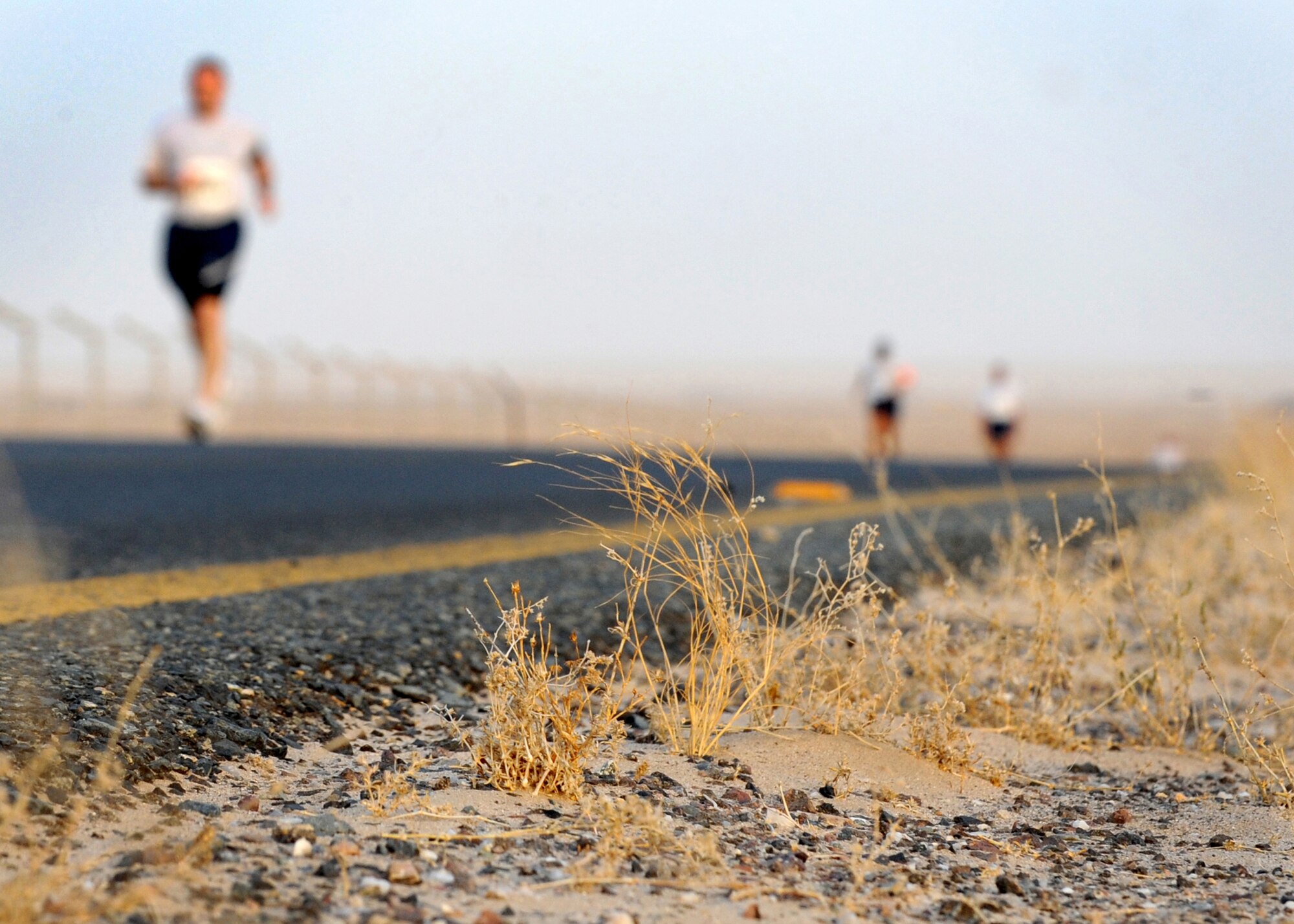 SOUTHWEST ASIA - Airmen from the 386th Air Expeditionary Wing face the heat as they run the Air Force Half Marathon at an undisclosed air base here Sept. 10, 2010. The 386th Expeditionary Force Support Squadron hosted the event to support the Annual Air Force Marathon, which will take place Sept. 18 at Wright-Patterson Air Force Base, Ohio. The half marathon is a challenging 13.1-mile run. (U.S. Air Force photo by Senior Airman Laura Turner)