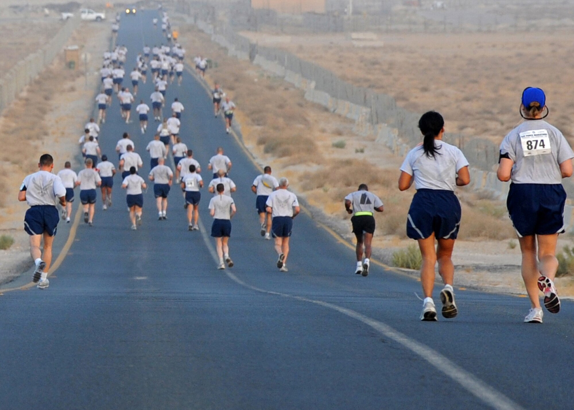 SOUTHWEST ASIA - Airmen from the 386th Air Expeditionary Wing hit the pavement as they run the Air Force Half Marathon at an undisclosed air base here Sept. 10, 2010. The 386th Expeditionary Force Support Squadron hosted the event to support the Annual Air Force Marathon, which will take place Sept. 18 at Wright-Patterson Air Force Base, Ohio. The half marathon is a challenging 13.1-mile run. (U.S. Air Force photo by Senior Airman Laura Turner)