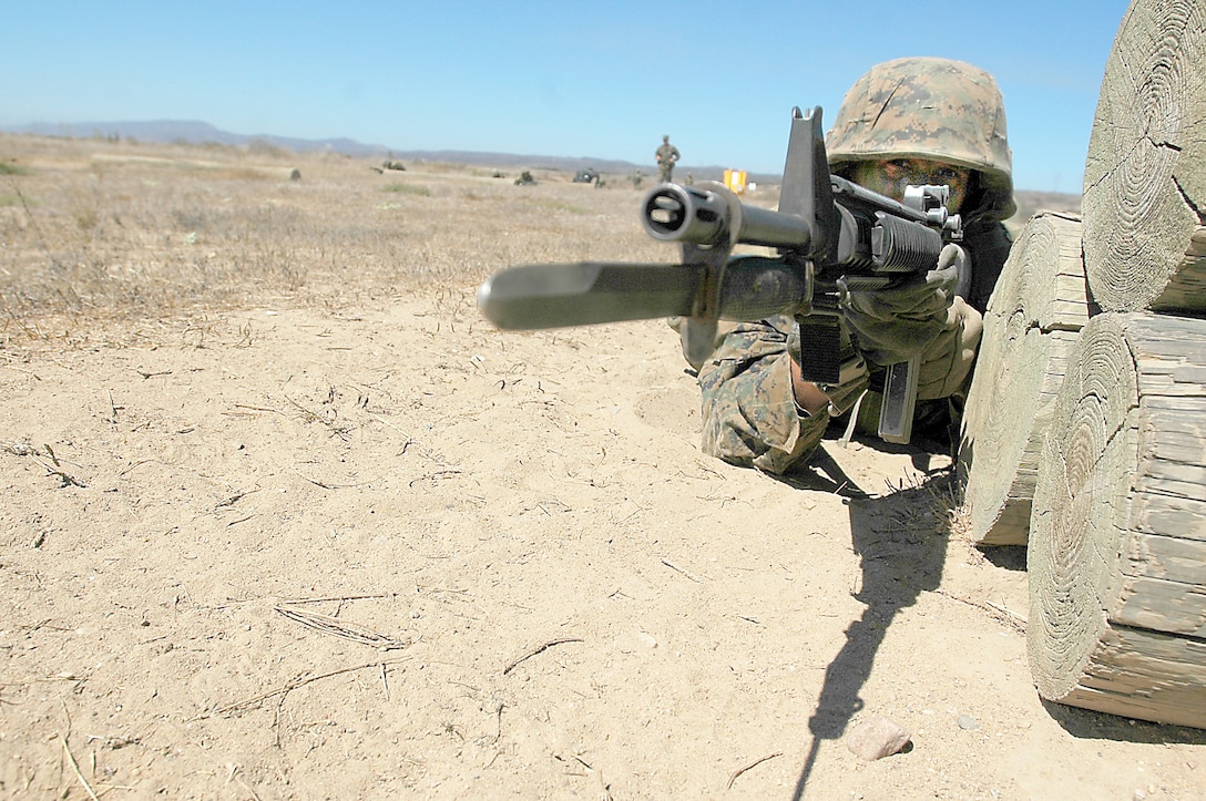 Recruit Dylan Renbarger-DeWulf, Platoon 3248, aims downrange at simulated tire-enemies to provide cover for his fire team during the Janson’s Thrust bayonet assault course event of the Crucible at Edson Range, Marine Corps Base Camp Pendleton, Calif., Sept. 14. During the course, four-man fire teams conduct buddy rushes and overcome obstacles to assault simulated tire-enemies with bayonet equipped rifles.