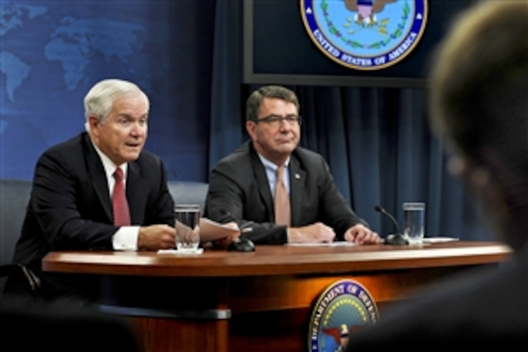 Defense Secretary Robert M. Gates, left, and Ashton Carter, under secretary of defense for Acquisition, Technology, and Logistics, brief the press on more productive defense spending plans at the Pentagon, Sept. 14, 2010. 