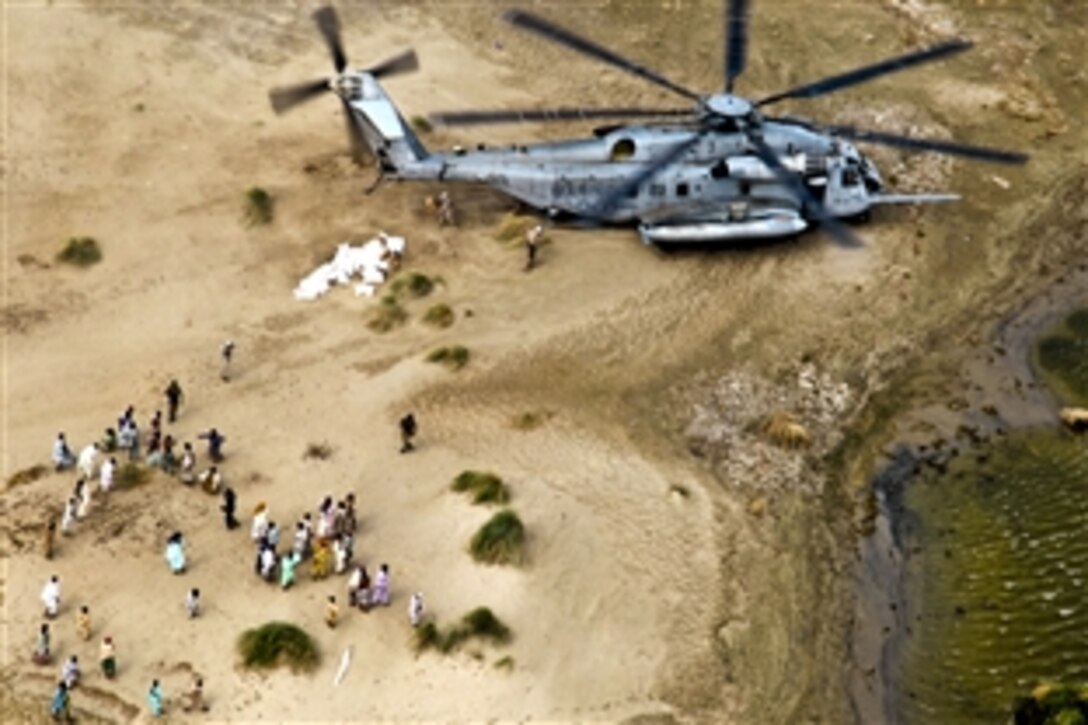U.S. Marines unload food and supplies for Pakistani flood victims in support of the flood relief effort in Pano Aqil, Pakistan, Sept. 11, 2010. The Marines are assigned to the 26th Marine Expeditionary Unit.