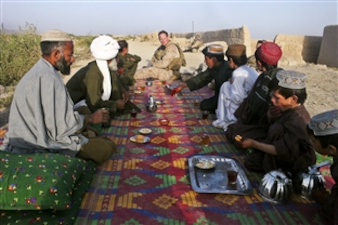 U.S. Marine Corps Cpl. Patrick Fields talks with village elders about civil affairs projects for their village in Shabu, Afghanistan, Sept. 10, 2010. Fields, a civil affairs noncommissioned officer, is assigned to Alpha Company, 1st Light Armored Reconnaissance Battalion.