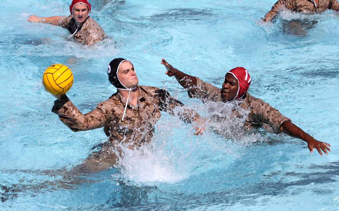 Tyler Kidder, 9th Communication Battalion “Chaps,” prepares to shoot a point during the championship game of the Pendleton Cup Combat Water Polo tournament at Camp Pendleton’s 13 Area pool, Sept.15. The top three teams in this year’s tournament included the 9th Communications Battalion “Chaps”, the Marine Corps Tactical System Support Activity “Gurus”, and the Assault Craft Unit-5 “Swift Intruders”.