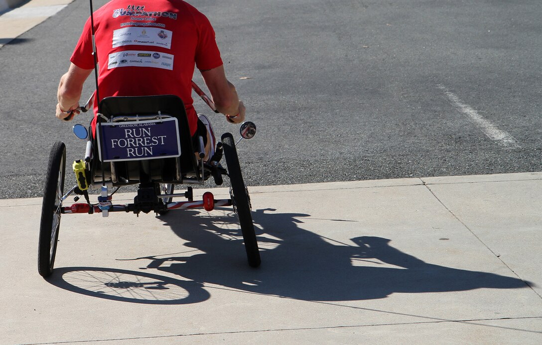 Colour Sgt. Damian Todd takes his hand bike for a spin around the parking lot of the National Museum of the Marine Corps before day six of the 63-day journey, Sept. 15, 2010. The runners' sixth day will take them from Quantico, Va., toward Charlottesville, Va.