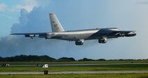 ANDERSEN AIR FORCE BASE, Guam ? Two E-3 Sentries  are seen in the background as an F-15C Eagle takes off on the Andersen flightline while participating in the Valiant Shield 2010 exercise, here Sep. 16.  The aircraft are a key component of the major joint flying exercise that kicked off this week. (U.S. Air Force photo by Airman 1st Class Jeffrey Schultze)