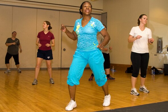 Lt. Col. Baseemah Najeeullah, 8th Medical Operations Squadron dental flight commander, leads a class through a Zumba exercise routine at the base gym, Kunsan Air Base, Republic of Korea, Sept. 15, 2010. Zumba is a dance fitness program combining Latin and international music with dance in an effort to make exercise fun. (U.S. Air Force photo/Staff Sgt. Jonathan Pomeroy) 
