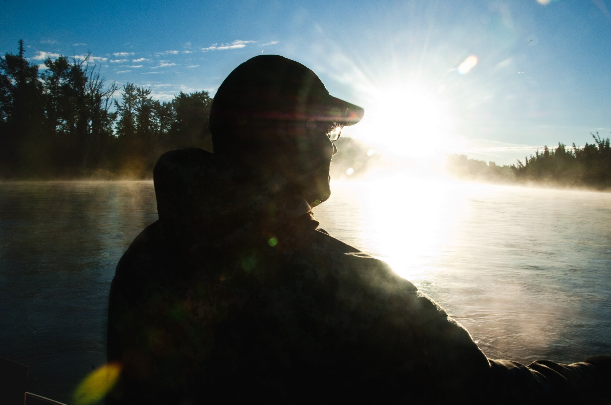 JOINT BASE ELMENDORF-RICHARDSON, Alaska -- Pfc. Emilio Rodriguez, Troop Medical Clinic, takes in the scenery, Sept. 11, during a Project Healing Waters chartered fishing trip on the Kenai River. (Air Force photo by Airman 1st Class Jack Sanders)