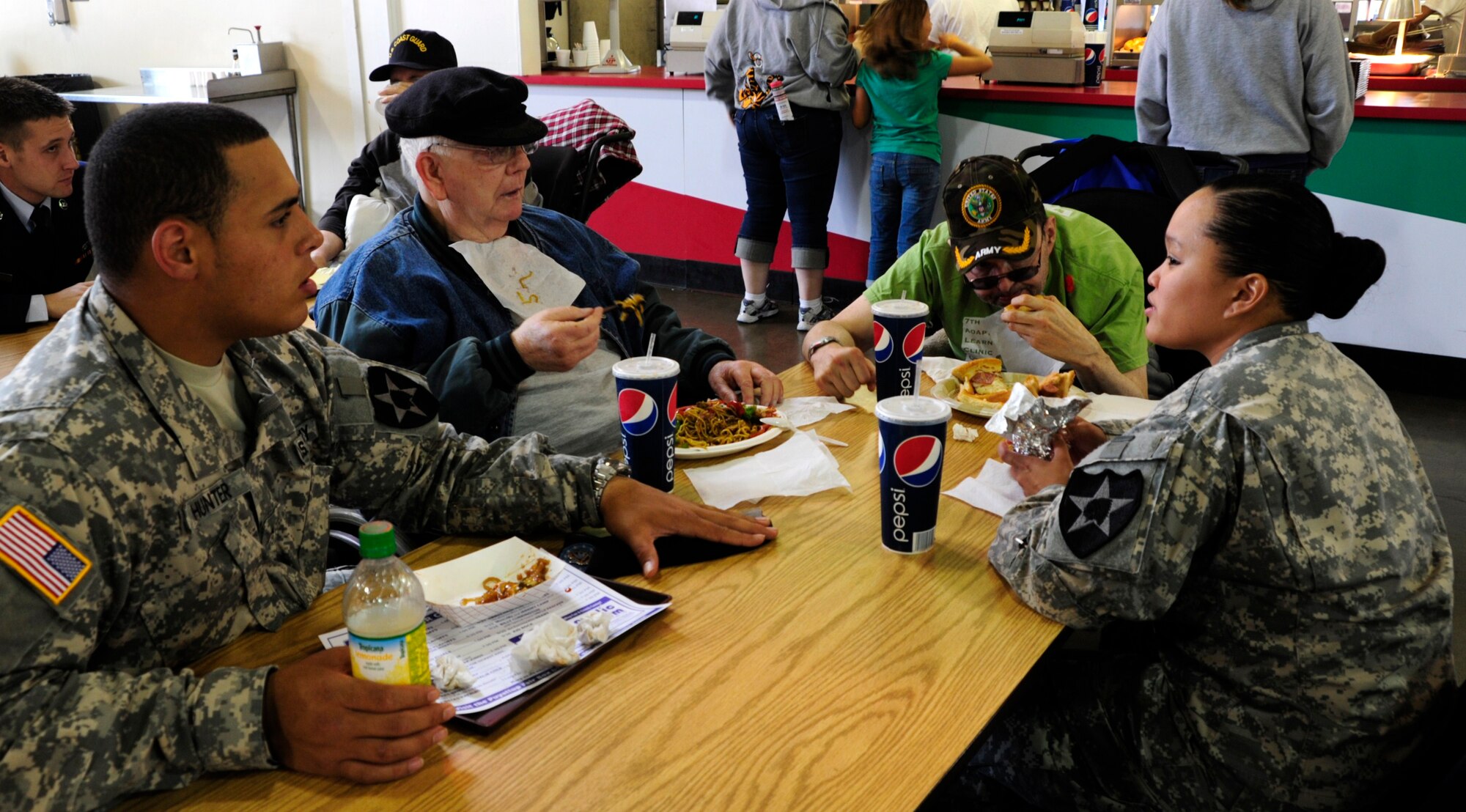 Soldiers assigned to Joint Base Lewis-McChord, Wash., eat lunch with veterans from the Washington State Soldiers Home Sept. 15 at the Puyallup Fair in Puyallup, Wash. The servicemembers shared the day and connected with the residents by touring the fairgrounds, eating lunch and even sharing stories. (U.S. Air Force Photo/Airman Leah Young)