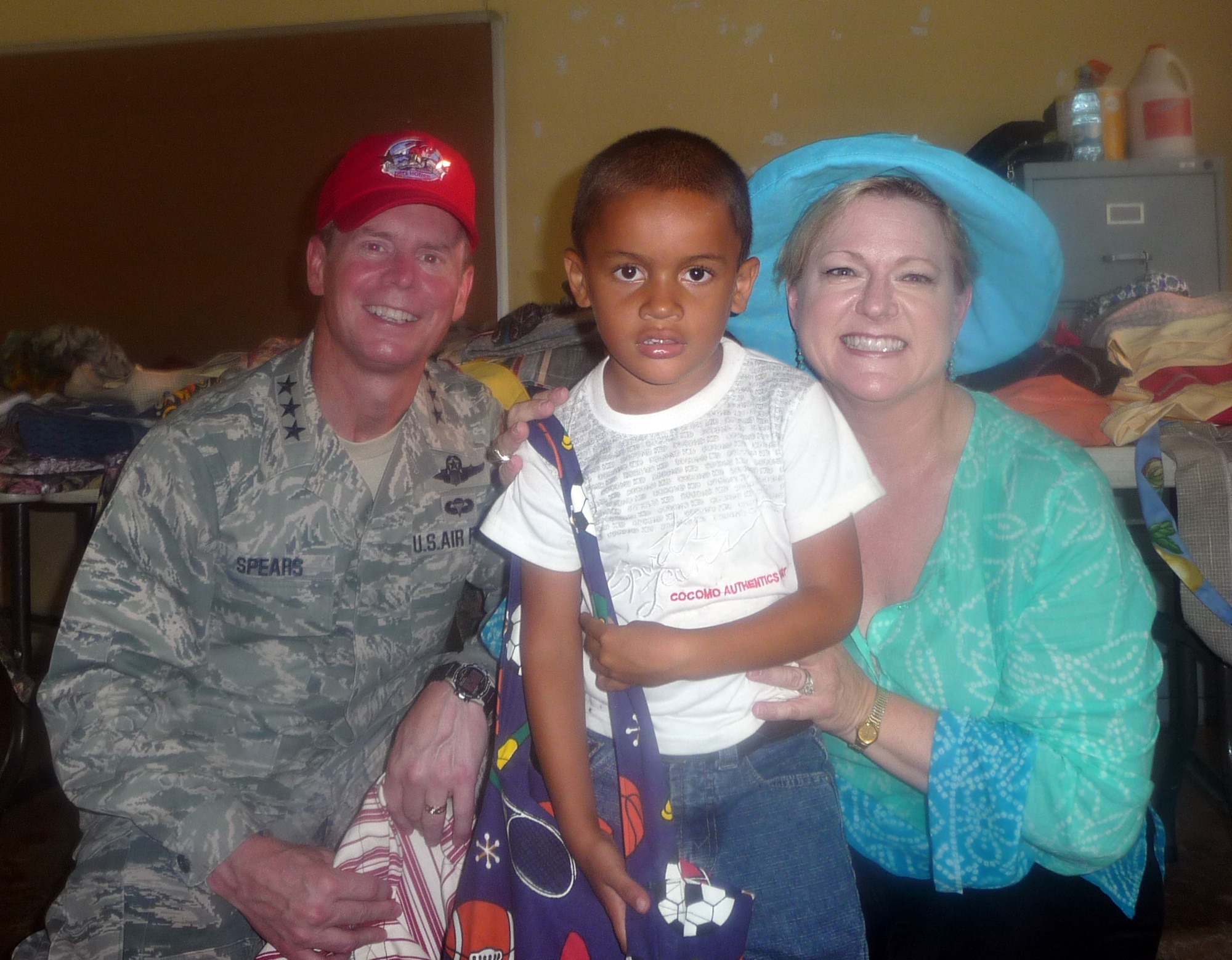 METETI, Panama -- Lt. Gen. Glenn Spears, 12th Air Force (Air Forces Southern) commander (left), and his wife Kim present a new bookbag to a student at the Rio Iglesia Elementary School during the New Horizons Panama 2010 closing ceremonies. (U.S. Air Force photo)