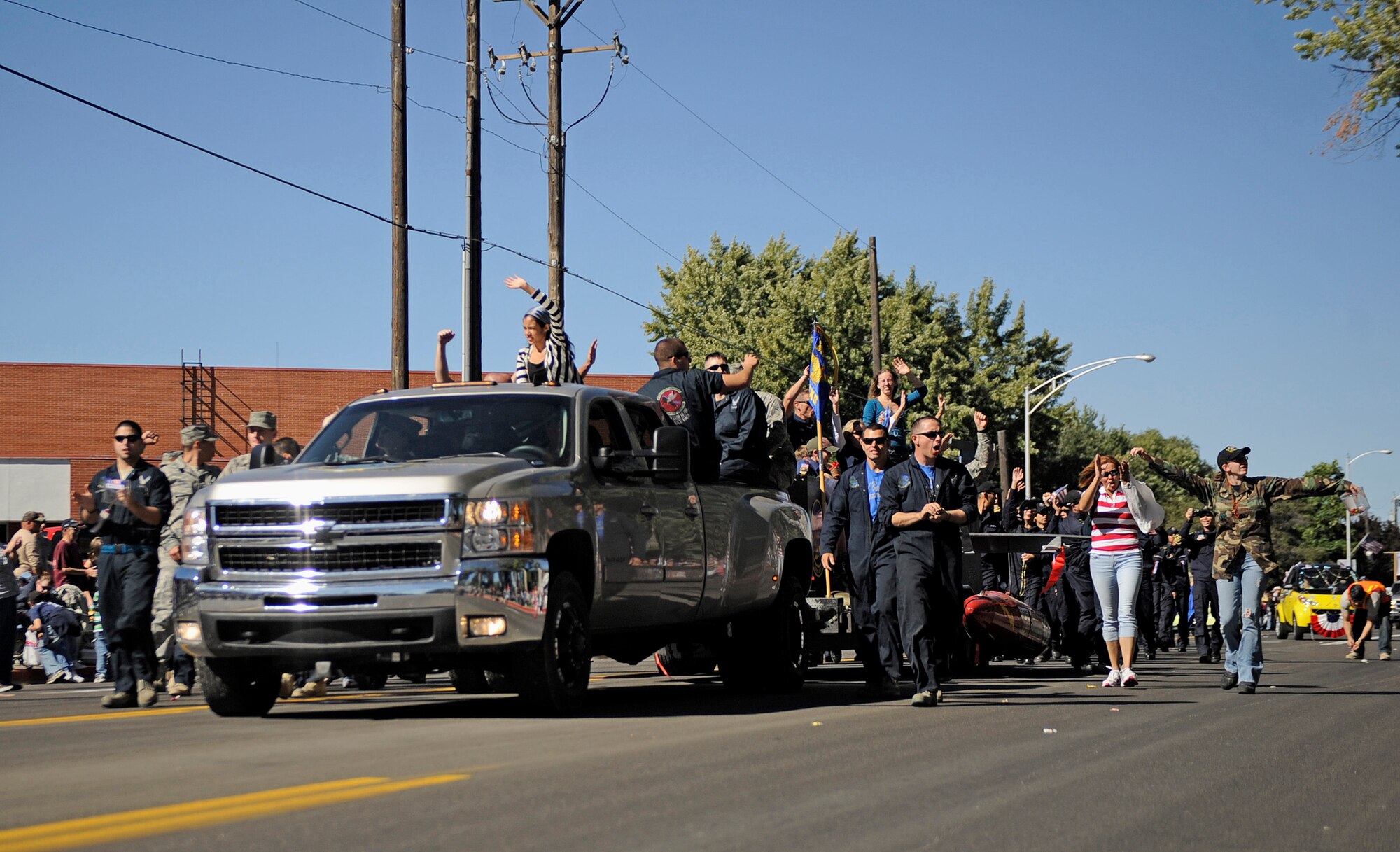 MOUNTAIN HOME AIR FORCE BASE, Idaho -- Members of the 389th Aircraft Maintenance Unit celebrate as they participate in the Air Force Appreciation Day parade in Mountain Home Sept. 11. This was the 50th anniversary of the AFAD celebration, which celebrates the friendship and partnership between the community and base. (U.S. Air Force photo by Senior Airman Renishia Richardson)