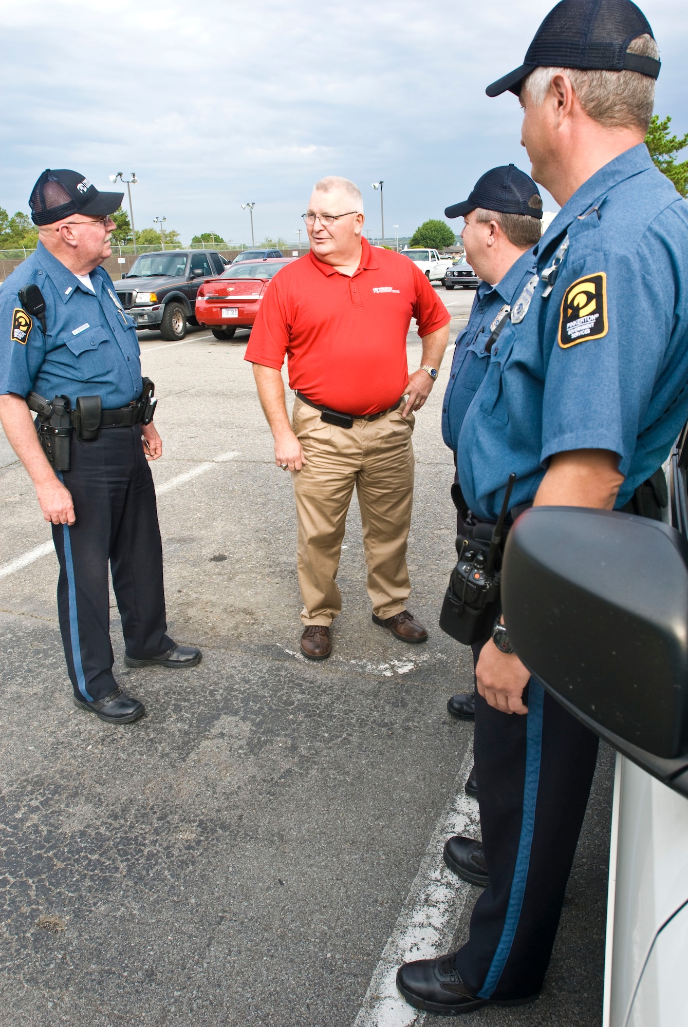 Roland Black, 19th Security Forces Squadron Pinkerton site manager, conducts a safety briefing Tuesday with fellow Pinkerton guards. The Sherwood native manages 54 Pinkerton guard officers and maintained 100 percent manning and contract posting requirements. (U.S. Air Force photo by Staff Sgt. Nestor Cruz)