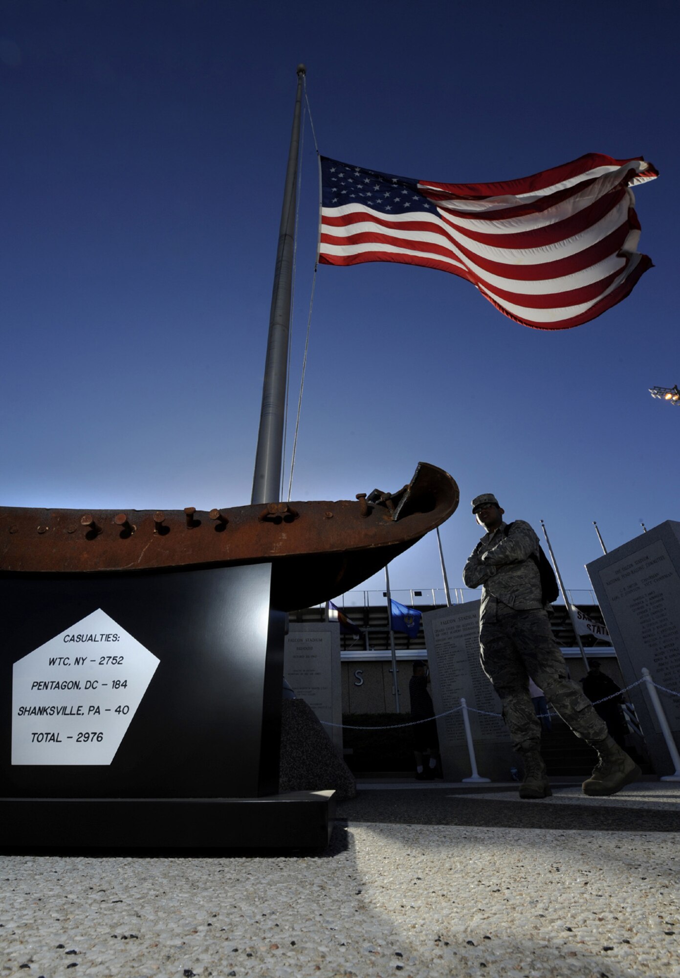 A cadet examines a twisted metal beam pulled from the wreckage of the World Trade Center set up outside Falcon Stadium Sept. 11, 2010, as a memorial of the Sept. 11, 2001, terrorist attacks. The Post 9/11 Foundation donated parts of the World Trade Center to the Academy and other Colorado Springs military installations. (U.S. Air Force photo/Dennis Rogers)