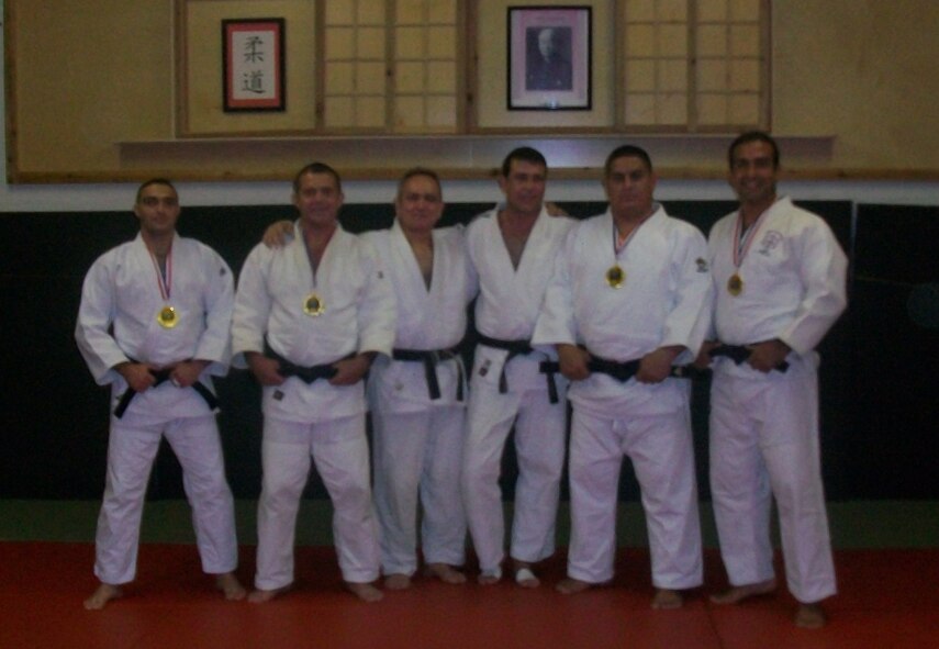 (Left to right) Airman 1st Class Geanny Hernandez Quiala, winner of the 66 kilogram gold medal , Abel Fernandez, winner of the 73 kilogram gold medal, Alberto Fernandez, Coach, Juan Vilacoba, Coach, Mariano Napoles, winner of the 100 kilogram gold medal, and Denis Solano, winner of the 90 kilogram gold medal all pose for a photo after their victories at the US Open of Judo in  Miami, Fla., Aug. 30, 2010. The entire team won the gold medal in competition. (U.S. Air Force photo, courtesy photo/Released)