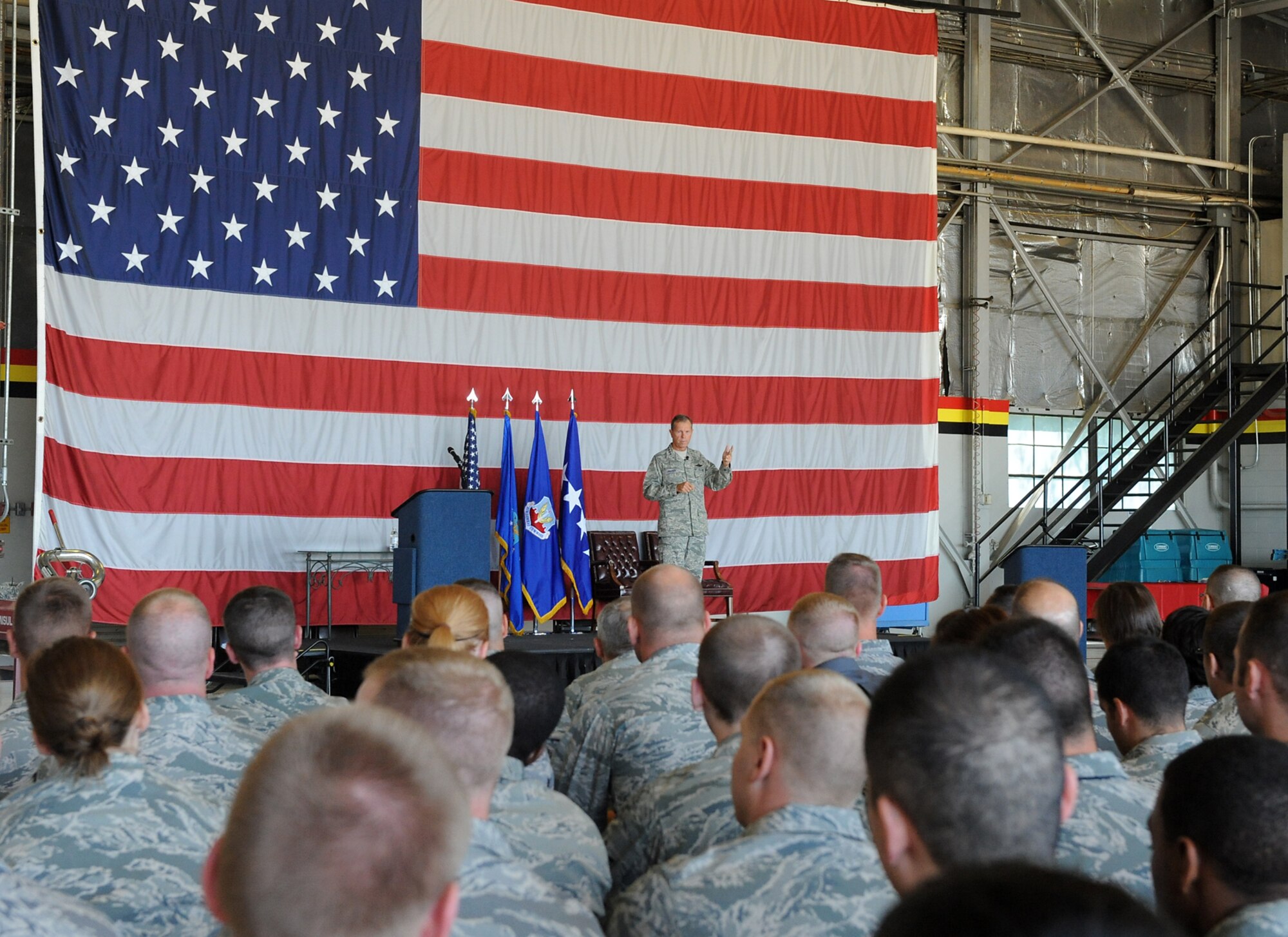 During his visit to Hill AFB, Gen. William M. Fraser III, Air Combat Command commander, briefs 388th Fighter Wing members at the "All-Call" held in Hangar 37 on Aug. 31. (Air Force photo by Alex Lloyd)
