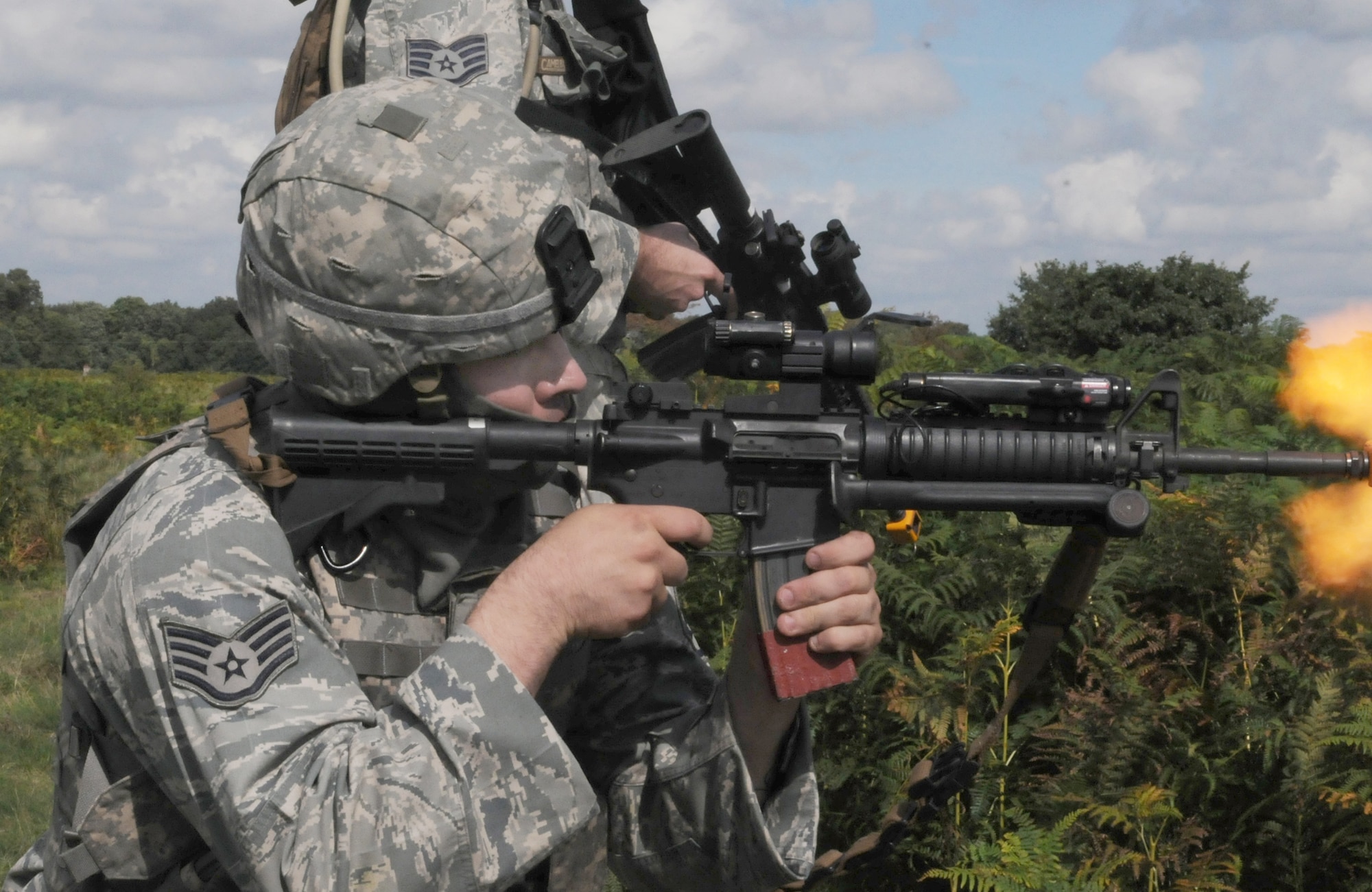 Staff Sgt. Jon Anderson provides cover fire while conducting a danger crossing training scenario Sept. 7, 2010, at Stanford Training Area, England. When not supporting the Royal Air Force Regiment in the field, more than 20 100th SFS Airmen held their own scenarios while they had access to the 30,000-acre training area. These Airmen were here to embed with British servicemembers who are about to deploy to Afghanistan to serve with U.S. Marines. This gave the regiment troops an idea of what it is like to work with U.S. forces. Sergeant Anderson is assigned to the 100th Security Forces Squadron at Royal Air Force Mildenhall, England. (U.S. Air Force photo/Staff Sgt. Thomas Trower)