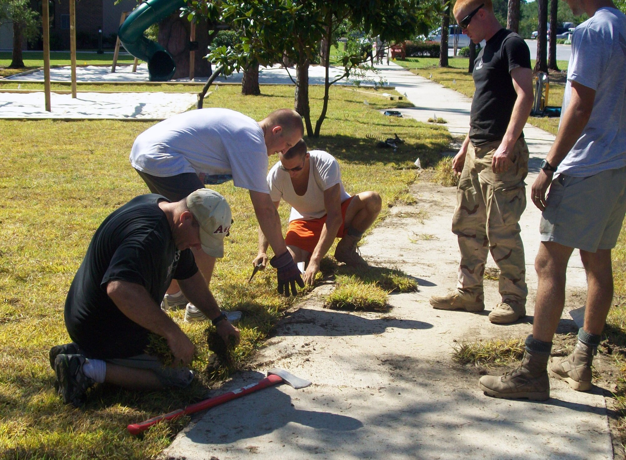 Tactical Air Control Party Airmen from Hurlburt Field work together to build a park for the Air Force Enlisted Village located in Shalimar, Fla., September 5, 2010. (Courtesy photo)