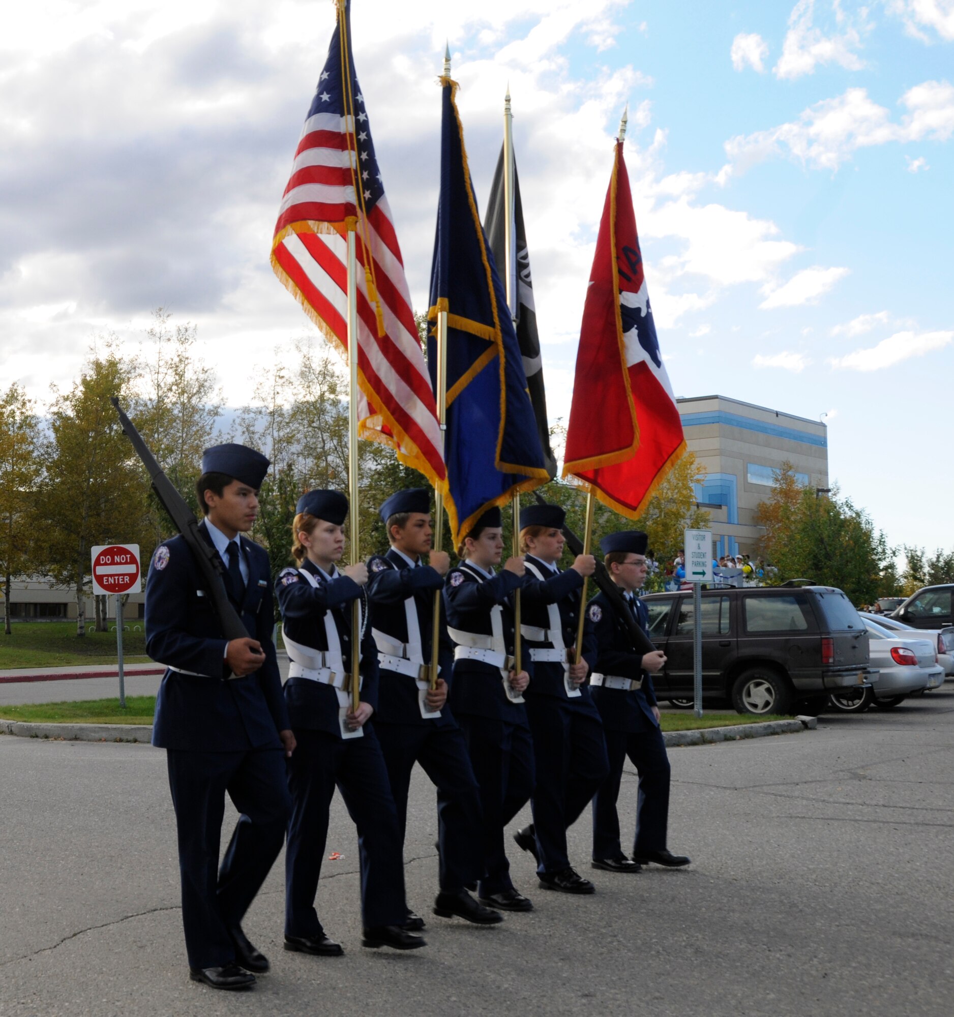North Pole Patriots Color Guard members get in step as they lead the way in North Pole High School's salute to the military parade Sept.10,2010, in North Pole, Alaska.  The theme selected was hometown heroes in honor of sacrifices made by the different military service branches.  Cadets are members of the North Pole High School Air Force Junior Reserve Officer Training program.  (U.S. Air Force photo by/Airman 1st Class Yash Rojas) 
