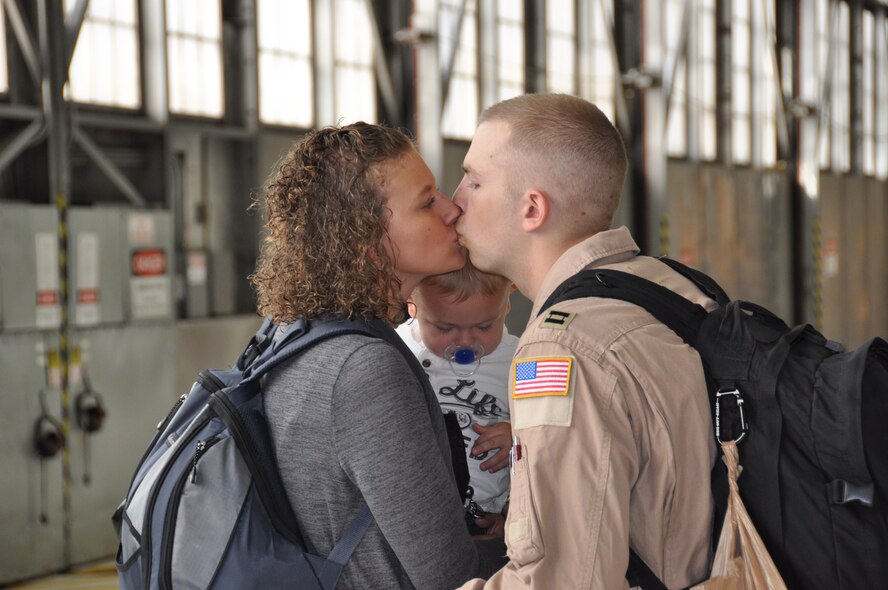 Capt. Lee Place, says goodbye to his wife Kelsey and son Kaden before deploying to Southwest Asia Sept. 10. (Air Force Photo/Paul Zadach)