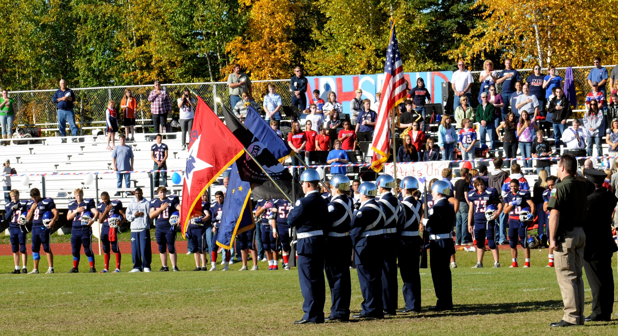North Pole Patriots Color Guard presents the colors Sept. 11, 2010, at Patriot Pride field in North Pole, Alaska. The event was a special ceremony in memory of the tragic events that occurred this date in 2001.  Cadets are members of North Pole High School Junior Reserve Officer Training program.  (U.S. Air Force photo by/Airman 1st Class Yash Rojas)
