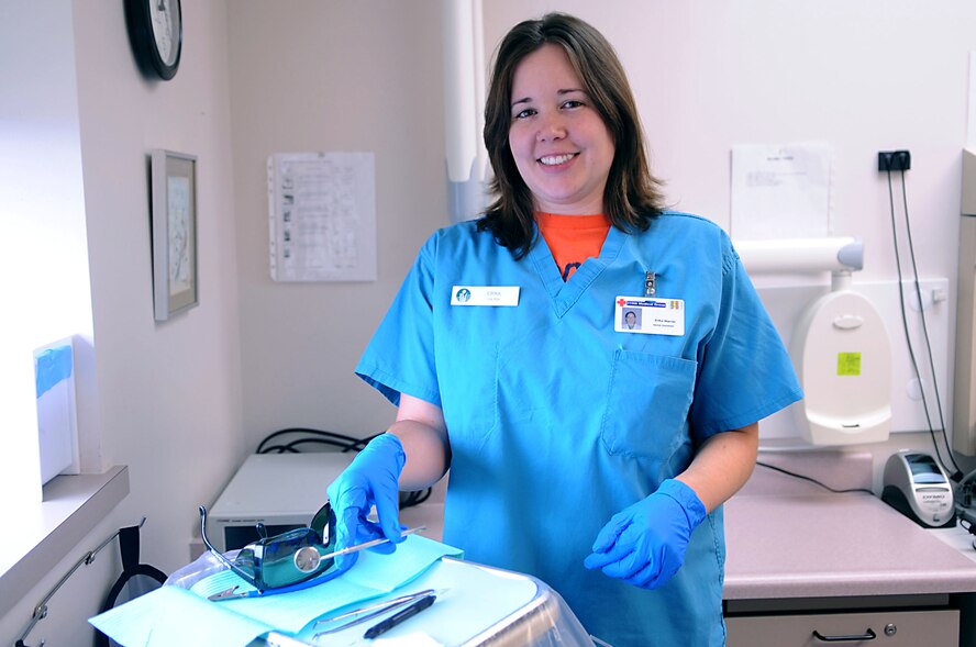 Erika Warner, 319th Medical Dental Operation Squadron, poses for a picture while preparing a tool tray for the next patient Sept. 15, Grand Forks Air Force Base, N.D. (U.S. Air Force photo by Senior Airman Amanda N. Stencil)   