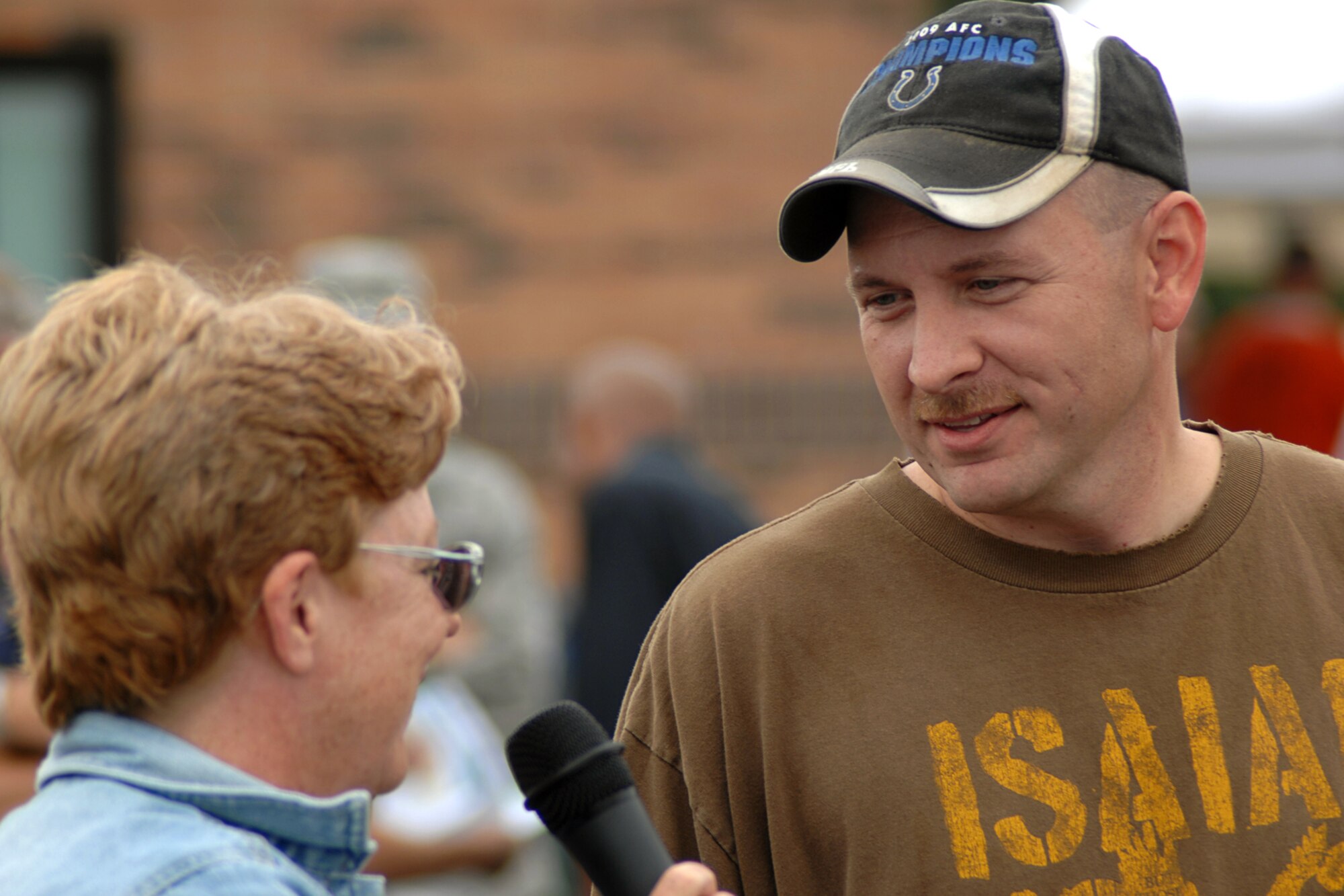 GRISSOM AIR RESERVE BASE, Ind., -- Tech. Sgt. Charles Smith, a vehicle operator with the 434th Logistics Readiness Squadron, talks with Master Sgt. Tina Youker, 434th Operations Group unit career advisor, prior to a watermelon seed spitting contest. (U.S. Air Force photo/Tech. Sgt. Douglas Hays)