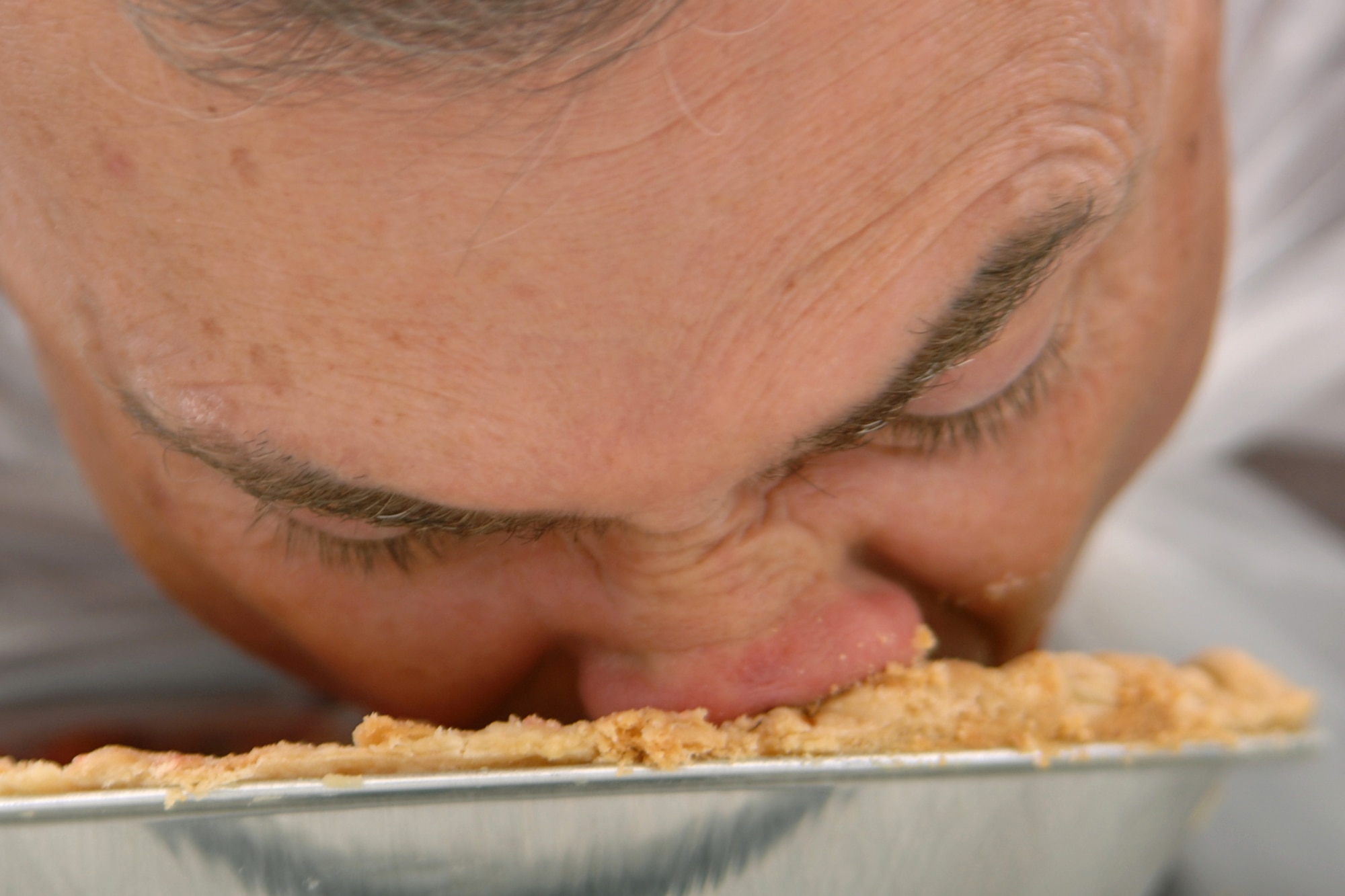 GRISSOM AIR RESERVE BASE, Ind., -- Col. William T. "Tim" Cahoon, 434th Air Refueling Wing commander, digs in during the pie eating contest held during the family day picnic held during the September unit training assembly. (U.S. Air Force photo/Tech. Sgt. Douglas Hays)