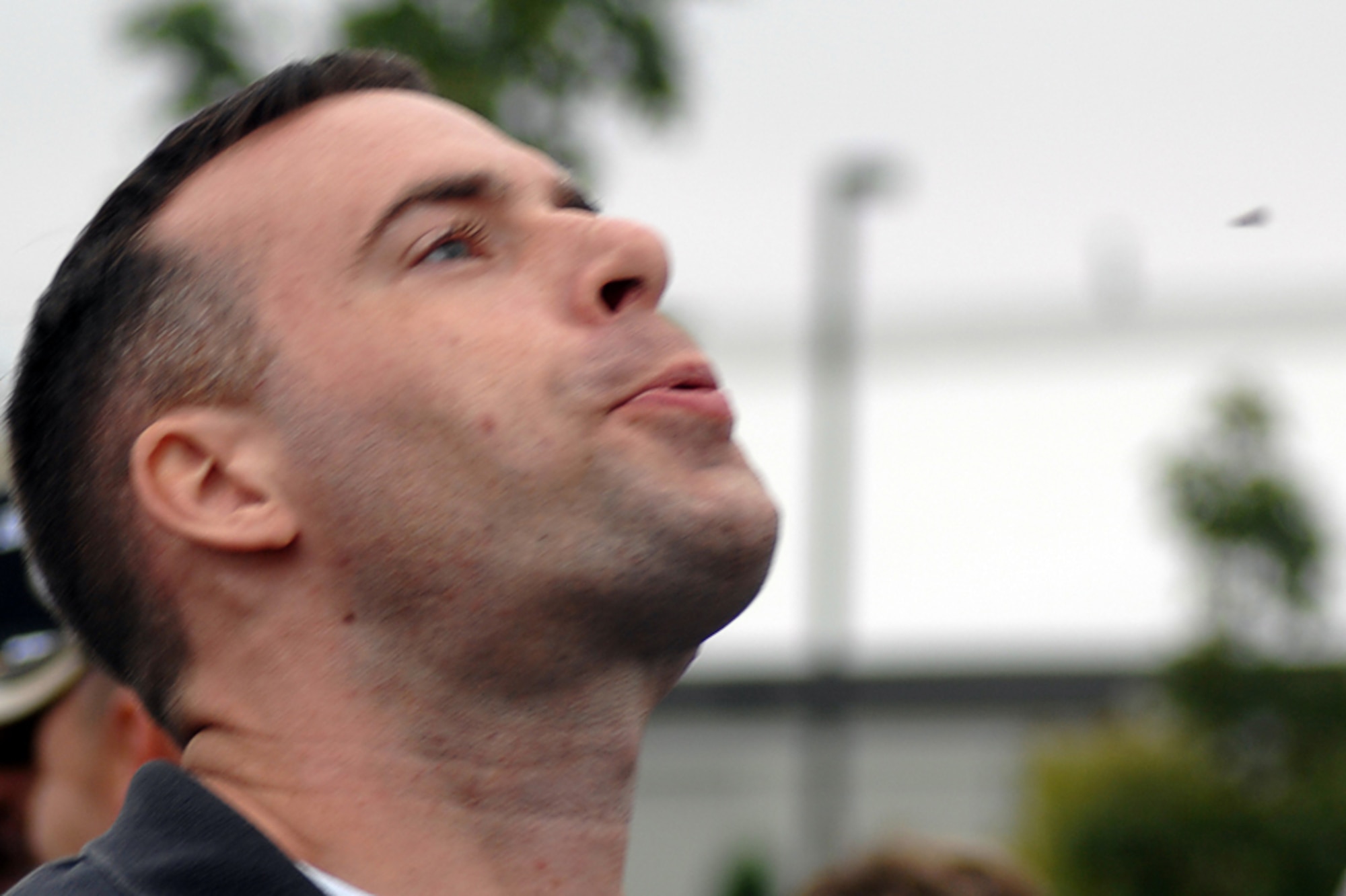 GRISSOM AIR RESERVE BASE, Ind., -- Senior Airman Andy McLaughlin, 434th Air Refueling Wing public affairs trainee, launches a watermelon seed during a seed spitting contest held during the family day picnic. Airman McLaughlin placed second in the event.  (U.S. Air Force photo/Tech. Sgt. Douglas Hays)