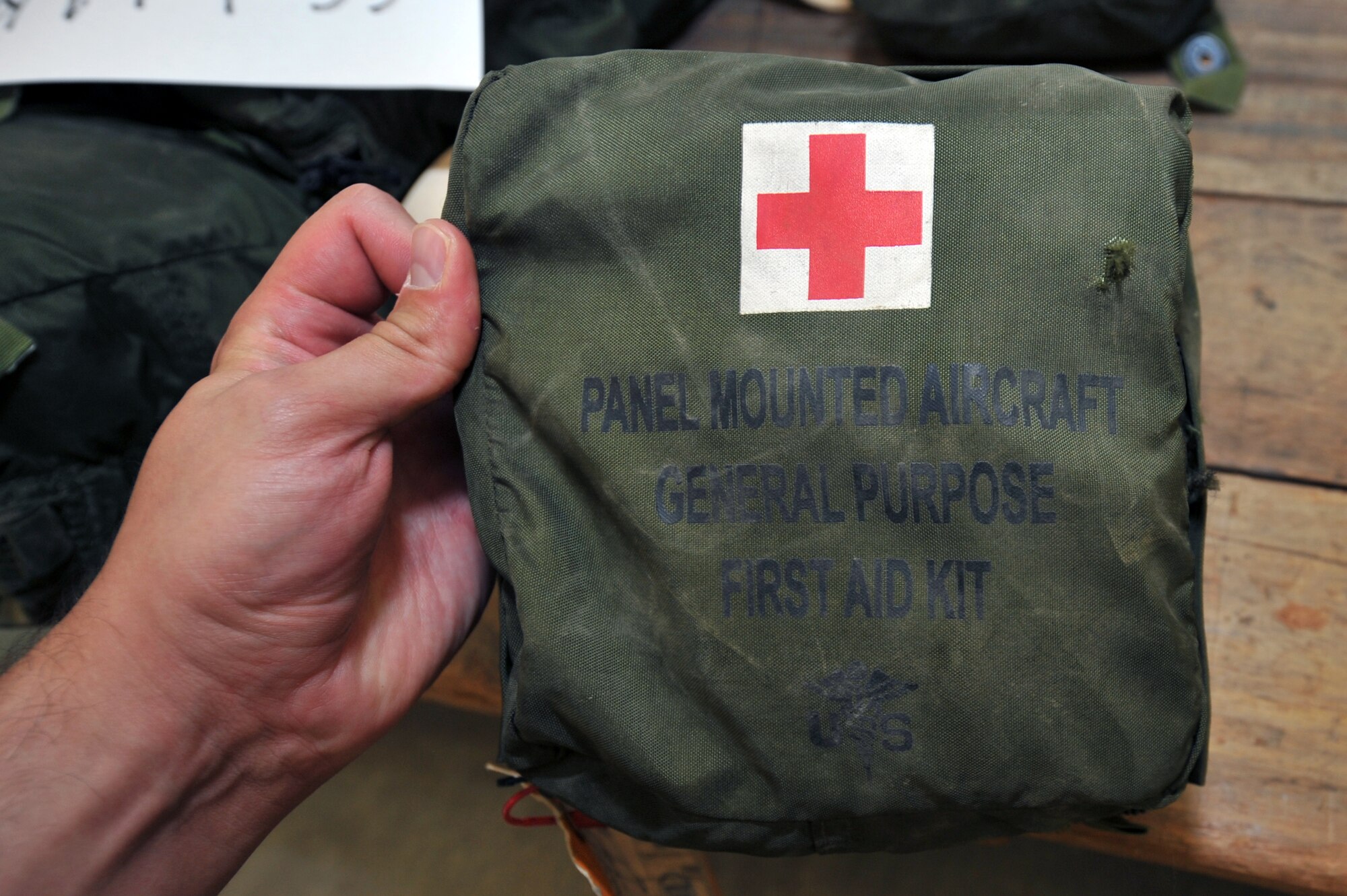 Staff Sgt. Jenny Markovitz, 19th Medical Group logistics section chief, recertifies a panel-mounted aircraft general purpose first aid kit Sept. 10. The 19th Medical Group logistics department supports three flying units and two emergency response units with general purpose kits and the Logistics Readiness Squadron with all individual first aid kits for deploying personnel. (U.S. Air Force photo by Staff Sgt. Chris Willis)