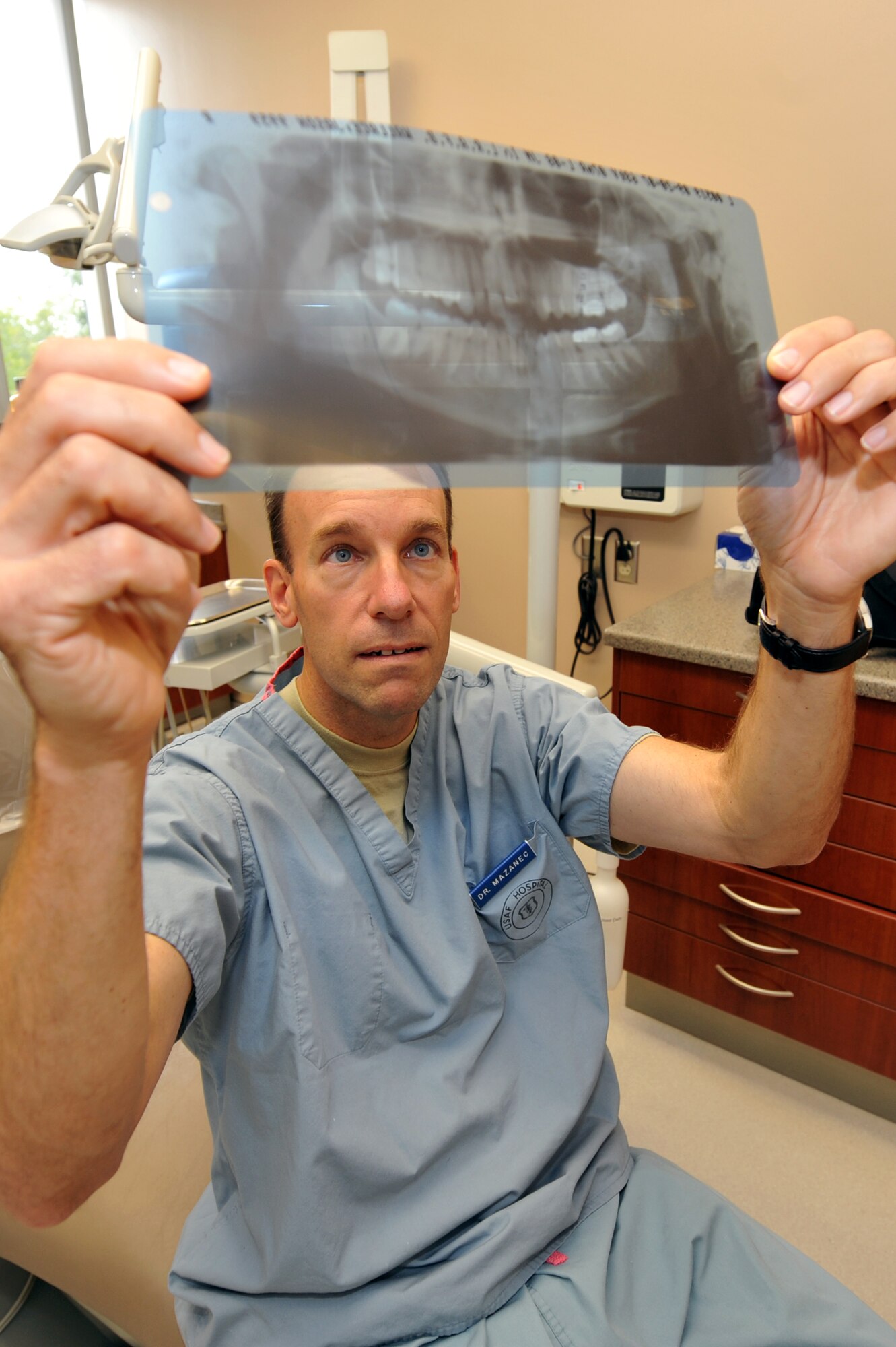 Lt. Col. Scott Mazanec, 19th Medical Group dentist, reviews a patient’s dental X-rays Sept. 10. The 19th Medical Group dental clinic cares for more than 1,100 patients per month. (U.S. Air Force photo by Staff Sgt. Chris Willis)