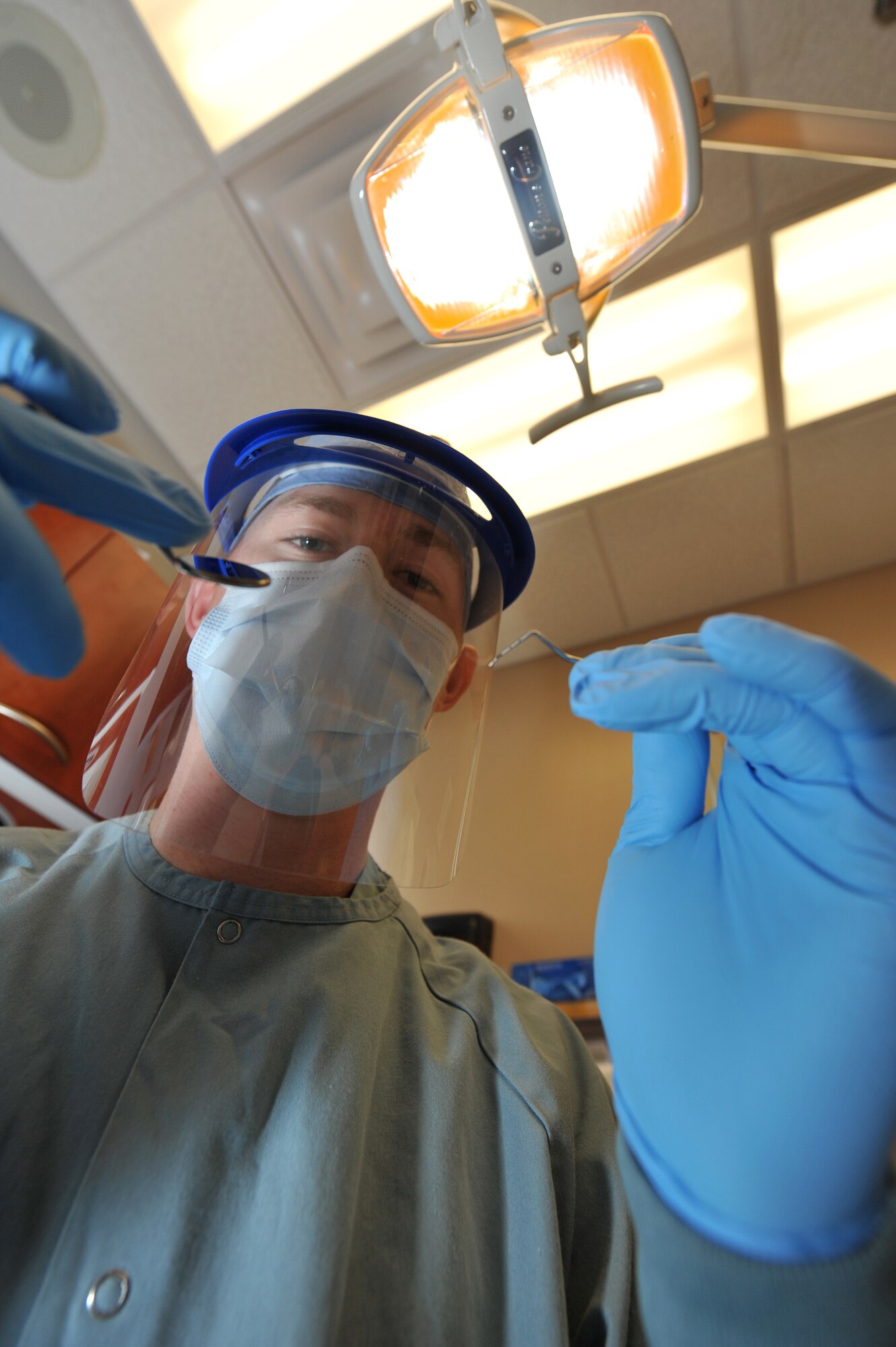 Senior Airman Caleb Sanford, 19th Medical Group dental technician, prepares to perform a teeth cleaning procedure Sept. 10. The 19th Medical Group dental clinic cares for more than 1,100 patients per month. (U.S. Air Force photo by Staff Sgt. Chris Willis)
