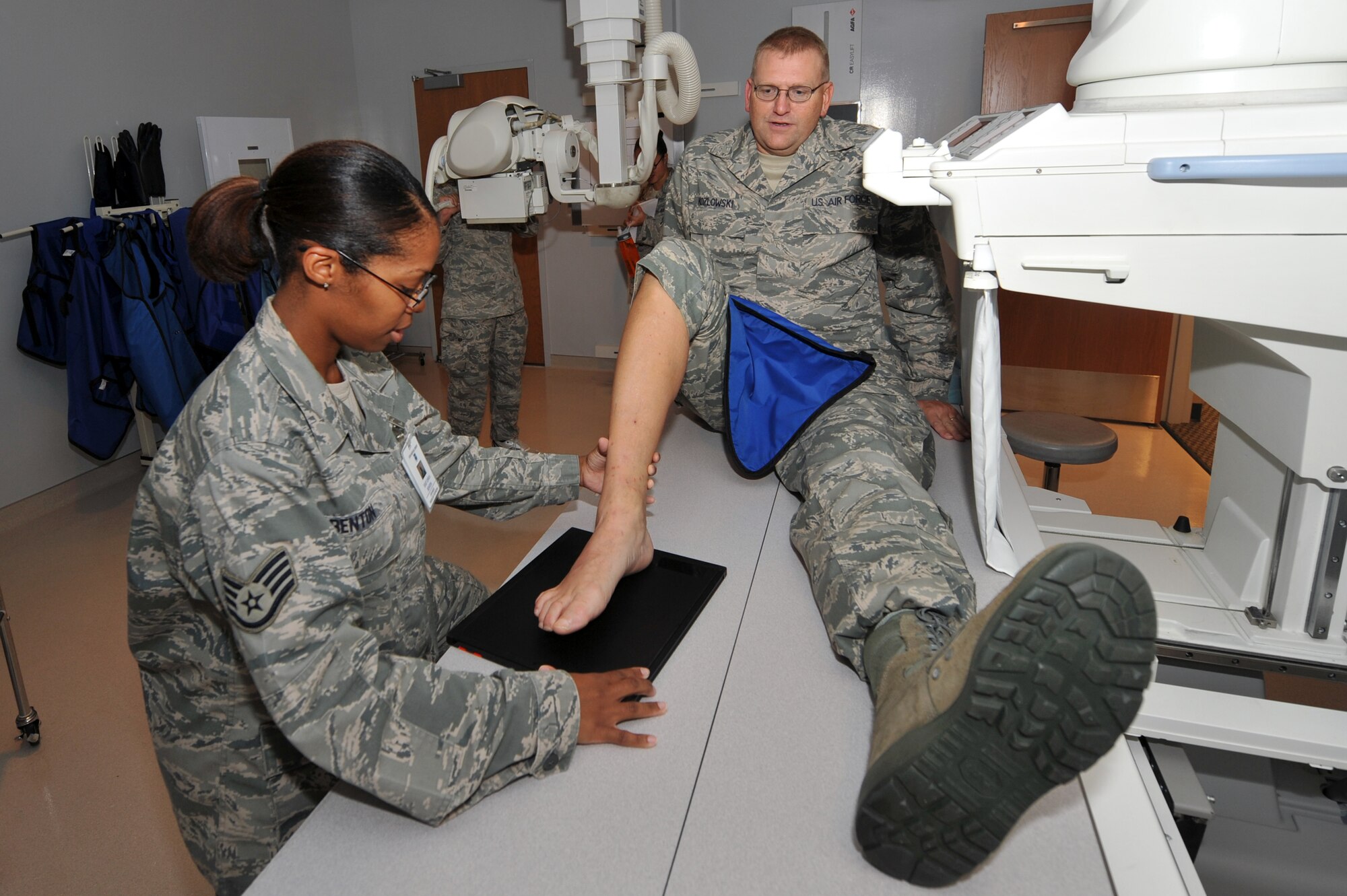 Staff Sgt. Carla Benton, 19th Medical Group diagnostic imaging journeyman, performs an X-ray Sept. 10 on the right foot of Master Sgt. Vincent Kozlowski, 314th Maintenance Operations Squadron product improvement manager. The 19th Medical Group radiology department sees more than 400 patients per month. (U.S. Air Force photo by Staff Sgt. Chris Willis)