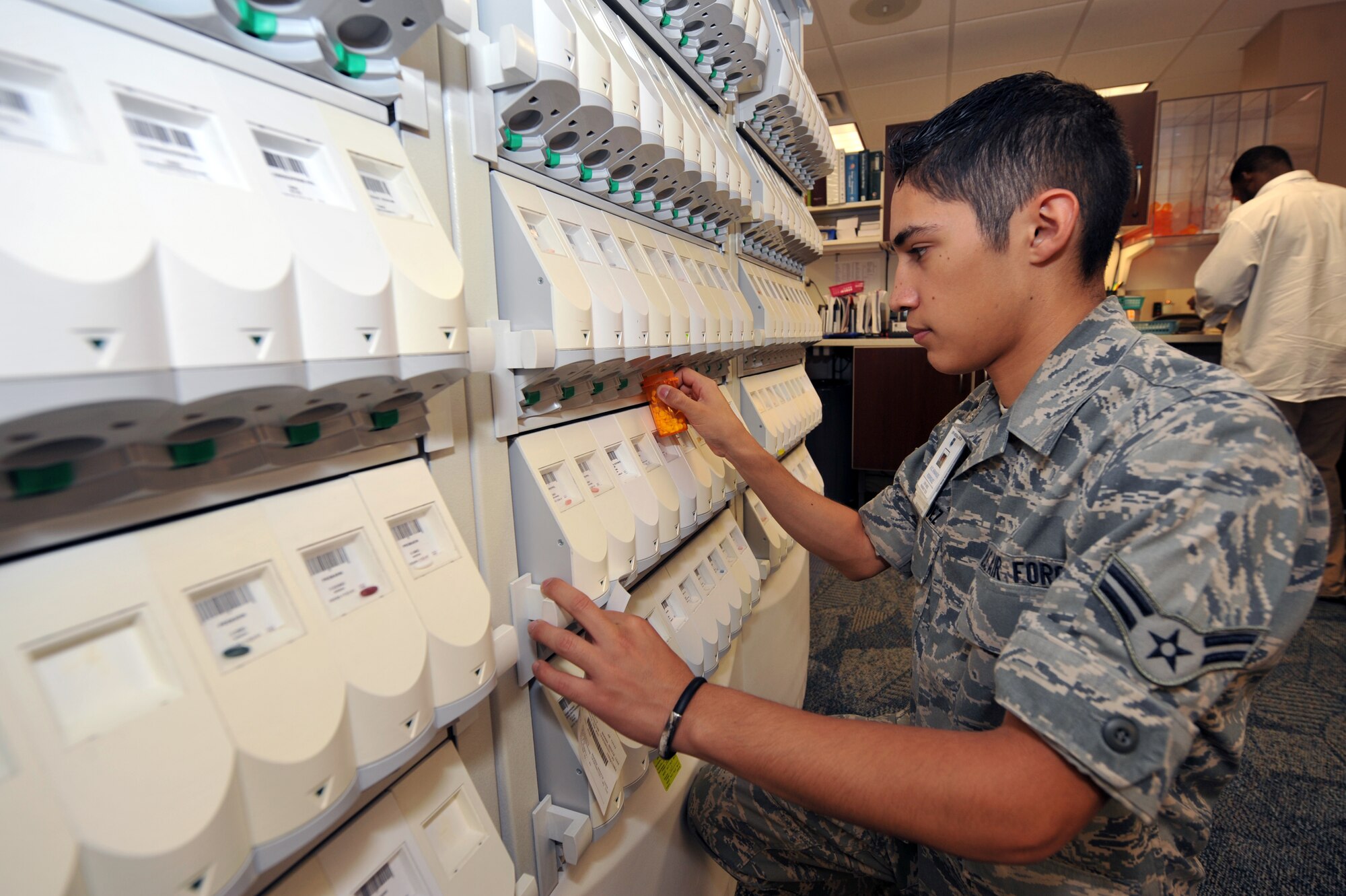 Airman 1st Class Armando Rodriquez, 19th Medical Group pharmacy technician, refills a prescription Sept. 10. The 19th Medical Group pharmacy fills more than 19,000 prescriptions per month. (U.S. Air Force photo by Staff Sgt. Chris Willis)