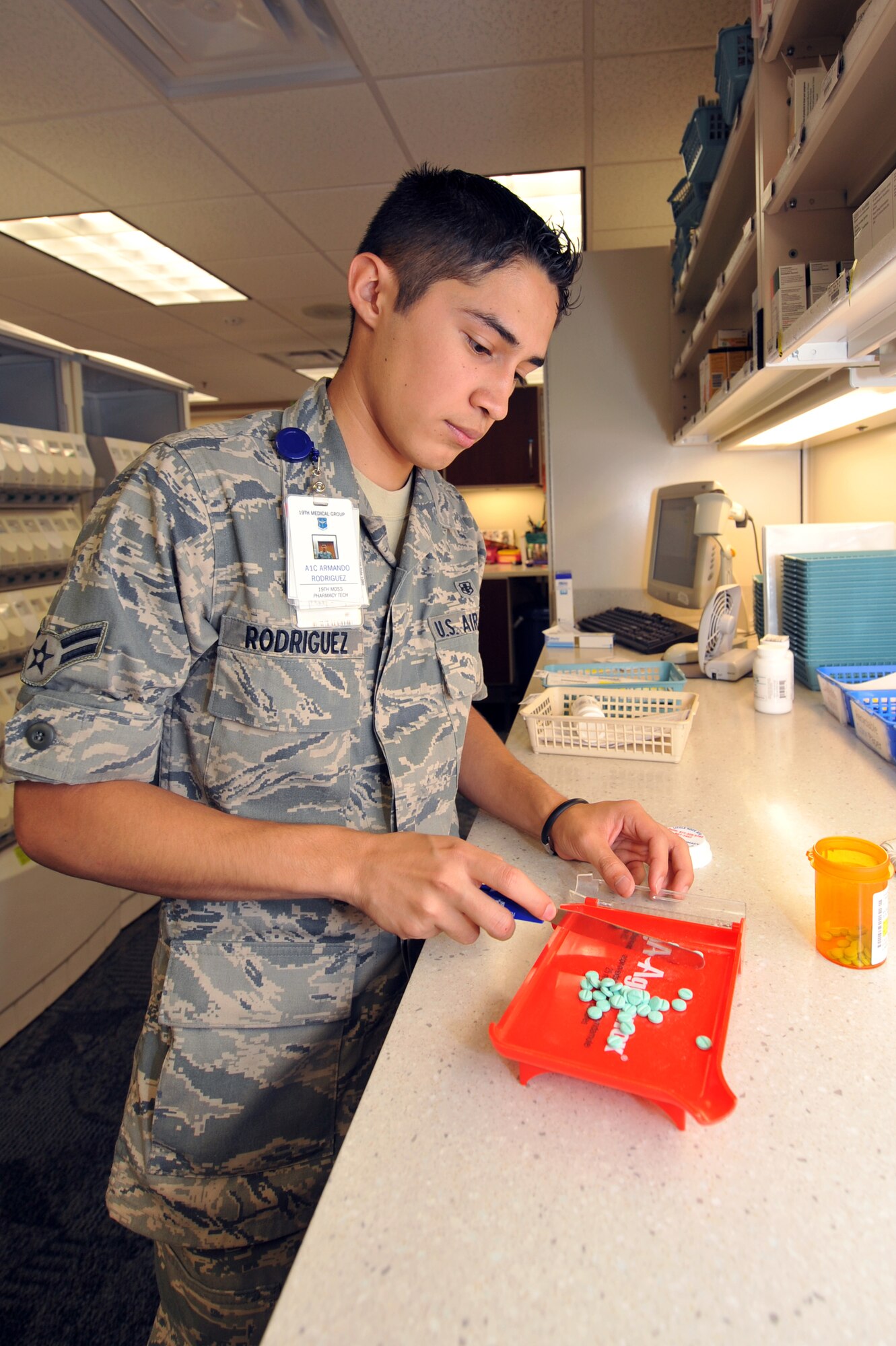 Airman 1st Class Armando Rodriquez, 19th Medical Group pharmacy technician, refills a prescription Sept. 10. The 19th Medical Group pharmacy fills more than 19,000 prescriptions per month. (U.S. Air Force photo by Staff Sgt. Chris Willis)