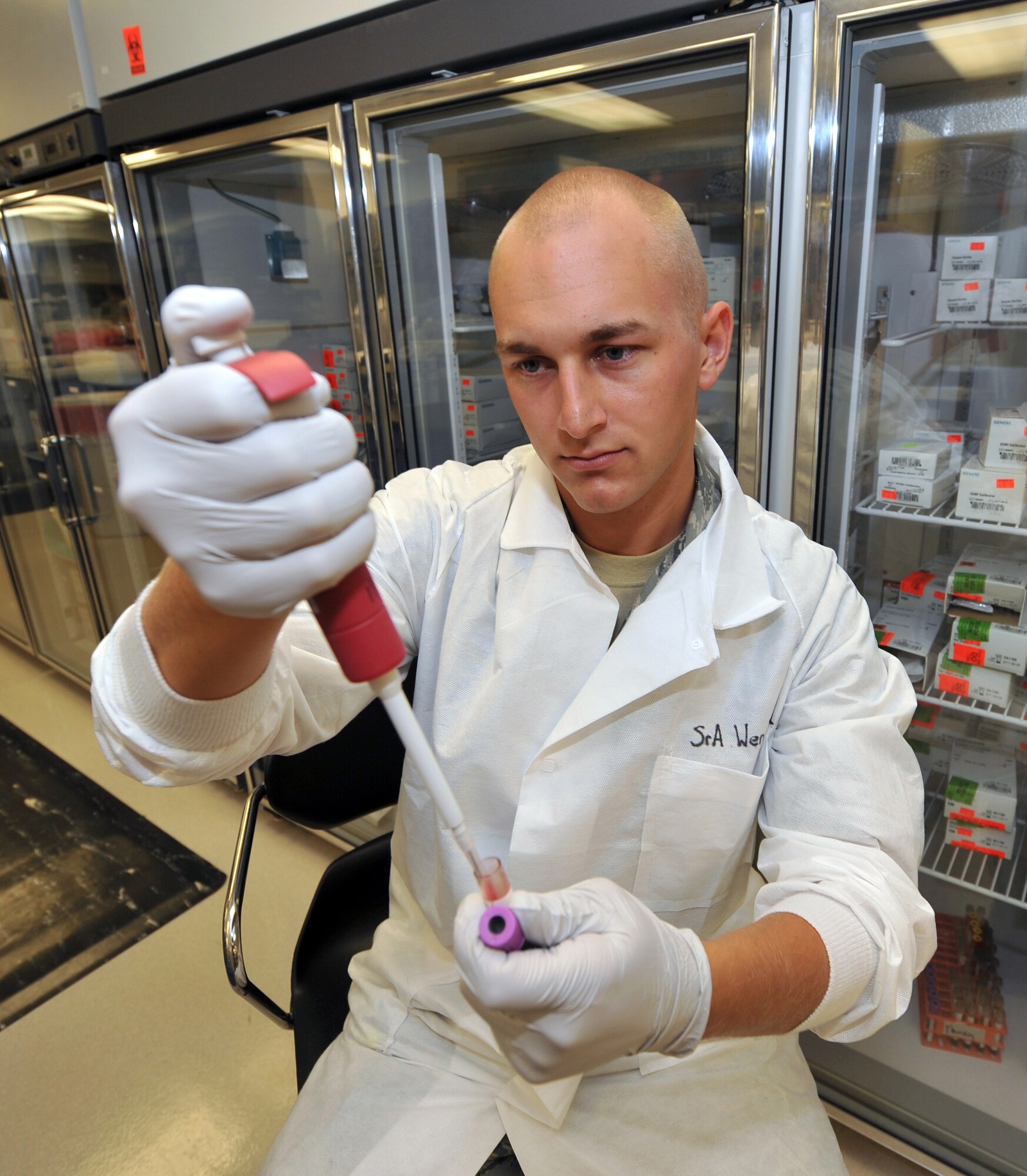 Senior Airman Grant Wendland, 19th Medical Group lab technician, demonstrates a pipetting blood practice Sept. 10. The 19th Medical Group laboratory provides more than 3,000 in-house lab test per month. (U.S. Air Force photo by Staff Sgt. Chris Willis)