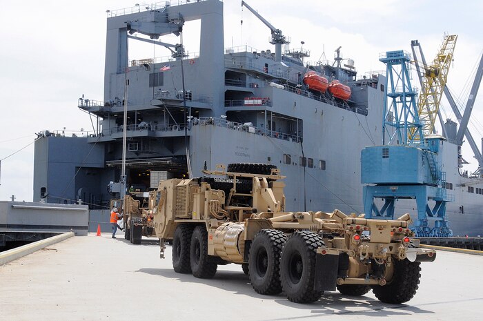 Up-Armored HUMVEEs prepare to roll onto prepositioning ship United States Naval Ship Soderman while inport Naval Weapons Station Charleston. The ship received more than 2,000 pieces of equipment including HUMVEES, armored vehicles, generators and ambulances during the two-week onload. (U.S. Navy photo by Mass Communication Specialist 1st Class Jennifer R. Hudson)