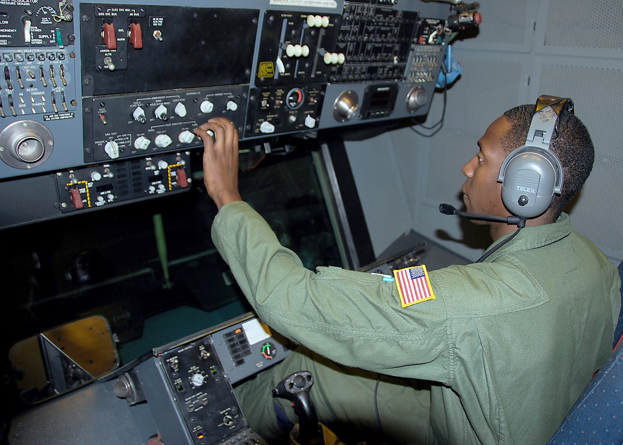 Staff Sgt. Devon Jarvis runs a pre-flight test on a KC-10 Extender's aerial refueling systems prior to a return flight Sept. 3, 2010, to Joint Base McGuire-Dix-Lakehurst, N.J. Sergeant Jarvis and eight other crew members were on a humanitarian mission to help transport privately-donated winter clothing that will be distributed to villages and orphanages in and around Kabul, Afghanistan. Sergeant Jarvis is a 76th Air Refueling Squadron boom operator. (U.S. Air Force photo/Staff Sgt. Shawn J. Jones)