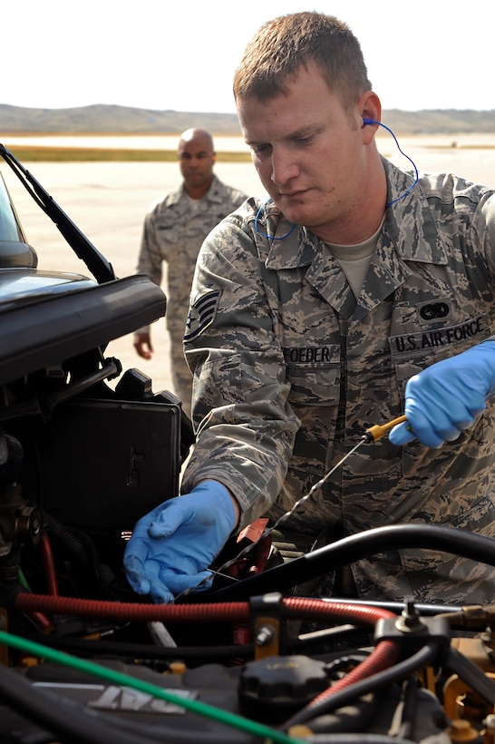 ELLSWORTH AIR FORCE BASE, S.D. - Staff Sgt. Bobby Pantfoeder, 28th Logistics Readiness Squadron fuels distribution superintendent, checks the engine oil of an R-12 Beta hydrant servicing vehicle, Sept. 14.  The 28 LRS fuels management flight provides refueling support to Ellsworth’s B-1B Lancer fleet, transient aircraft and ground vehicles. (U.S. Air Force photo/Staff Sgt. Marc I. Lane)