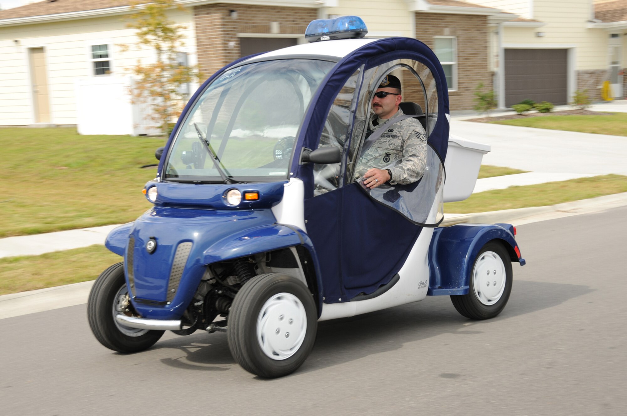 Staff Sgt. Christopher Pike, 81st Security Forces Squadron, drives through Bay Ridge family housing area in one of Keesler’s three electric vehicles used along with foot and regular vehicle patrols to protect Keesler’s housing areas.  (U.S. Air Force photo by Kemberly Groue)